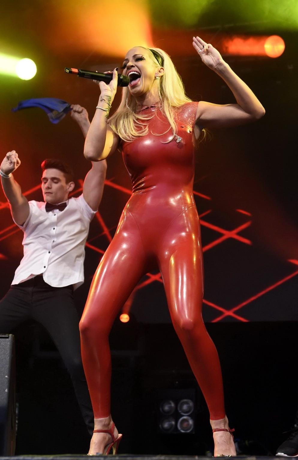 16P Sarah Harding in red latex catsuit performing at PRIDE
