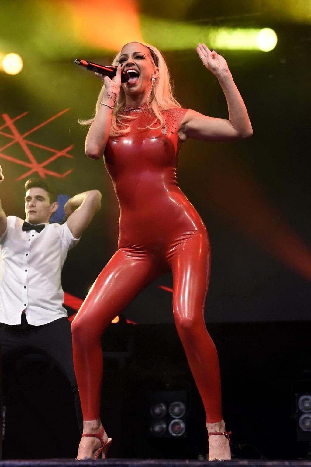 16P Sarah Harding in red latex catsuit performing at PRIDE