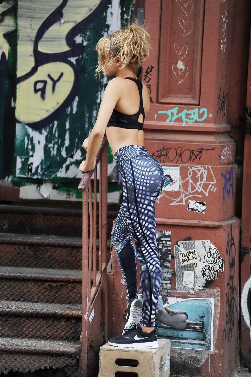 16P Hailey Baldwin wearing sports bra  tights on set