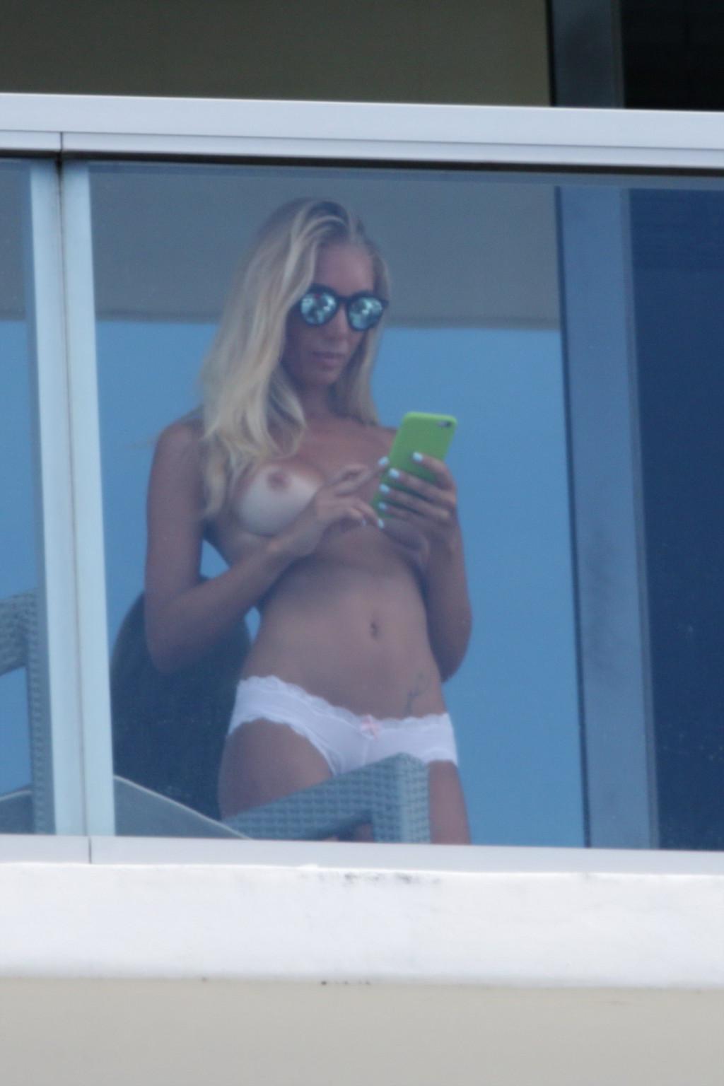 16P Laura Cremaschi caught topless at hotel balkony in Miami