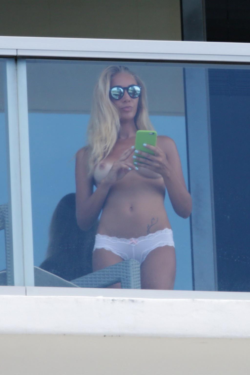 16P Laura Cremaschi caught topless at hotel balkony in Miami