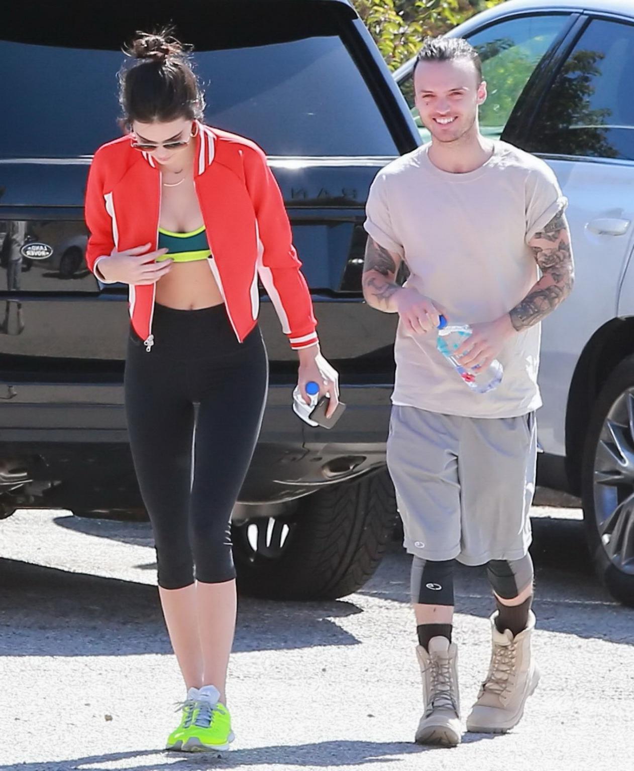 11P Kendall Jenner wearing tiny sports bra and tights while hiking in Malibu