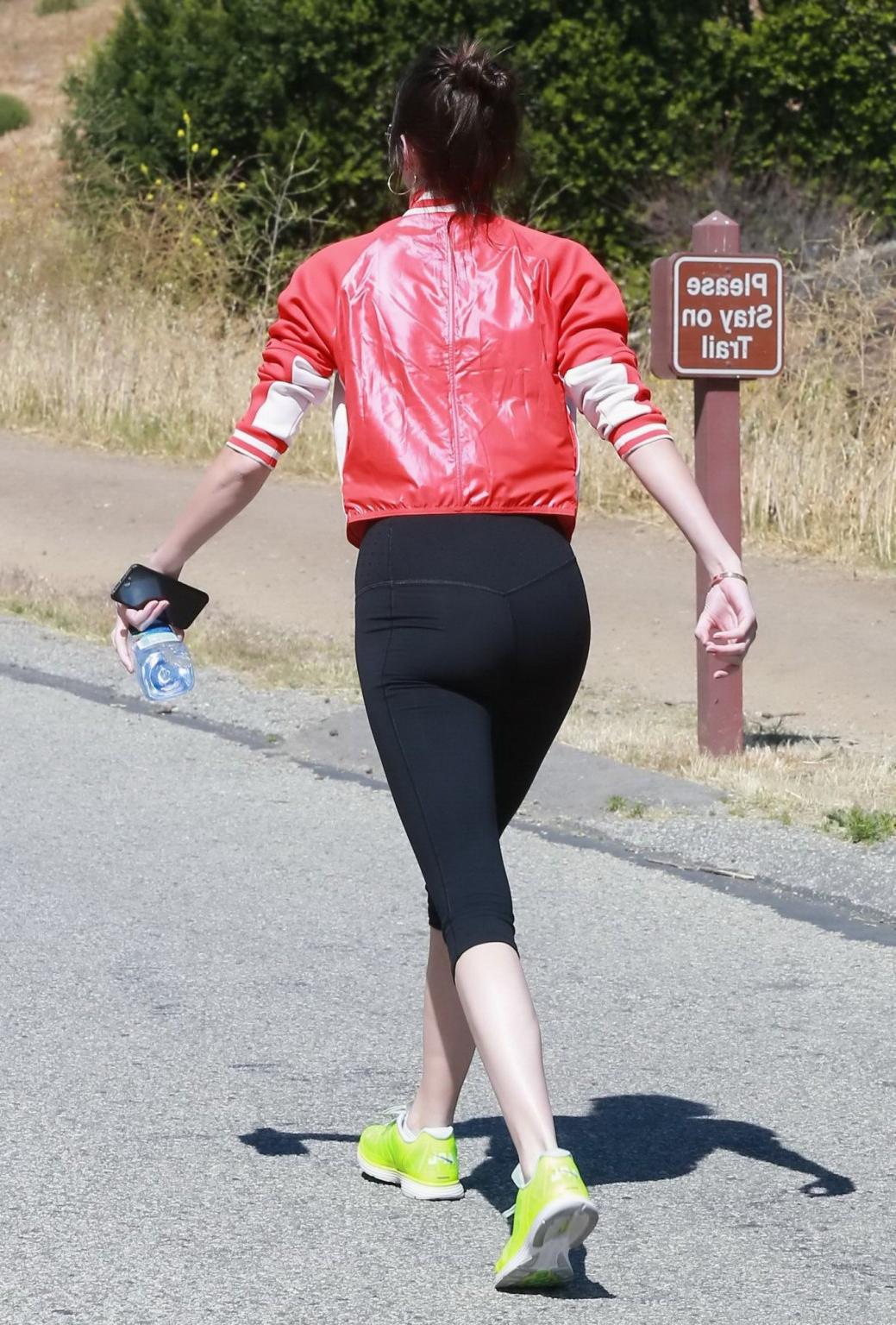 11P Kendall Jenner wearing tiny sports bra and tights while hiking in Malibu