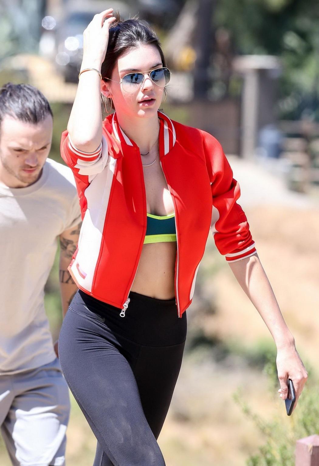 11P Kendall Jenner wearing tiny sports bra and tights while hiking in Malibu