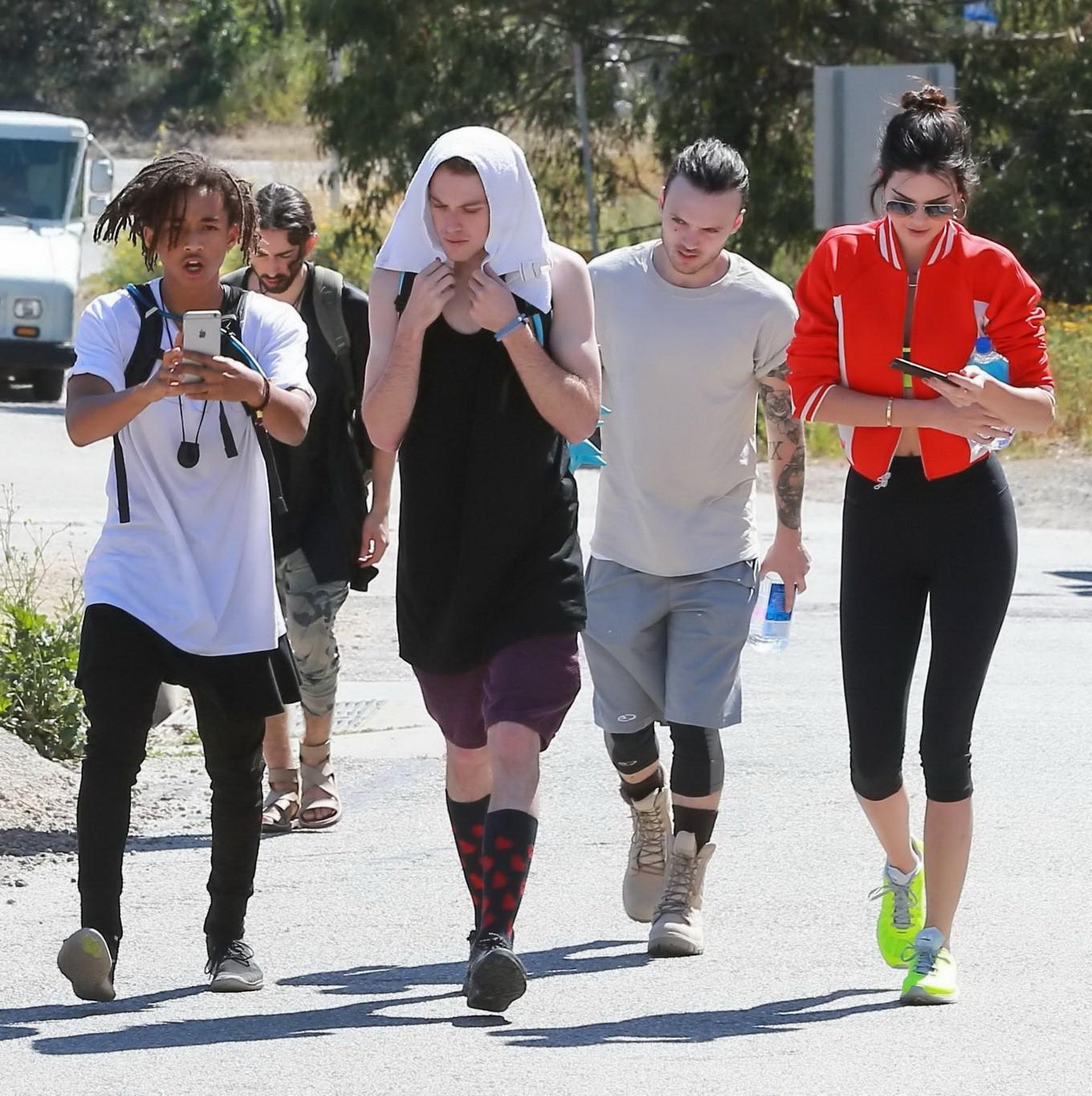 11P Kendall Jenner wearing tiny sports bra and tights while hiking in Malibu