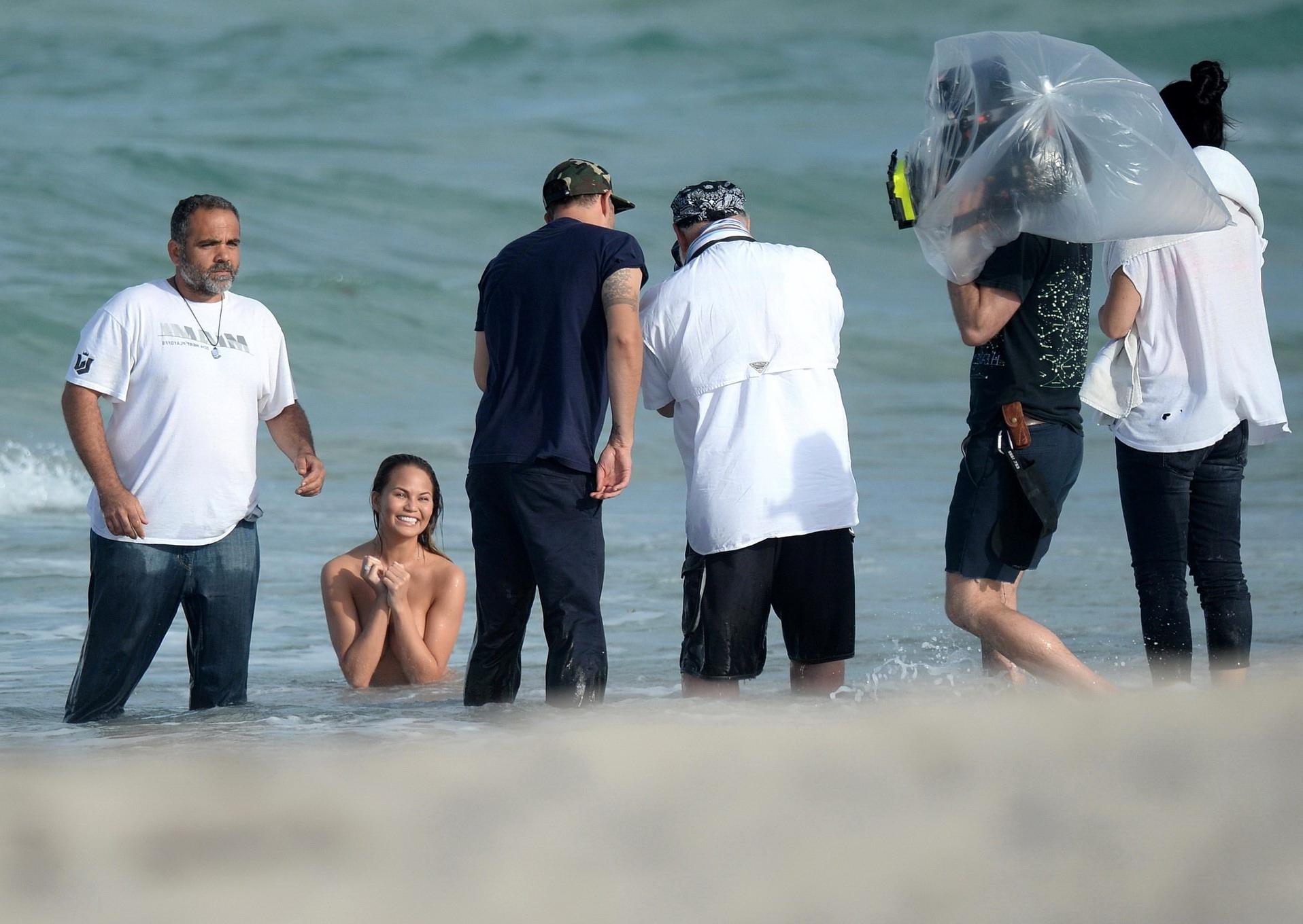16P Chrissy Teigen showing off her big boobs and shaved pussy at the photoshoot on M