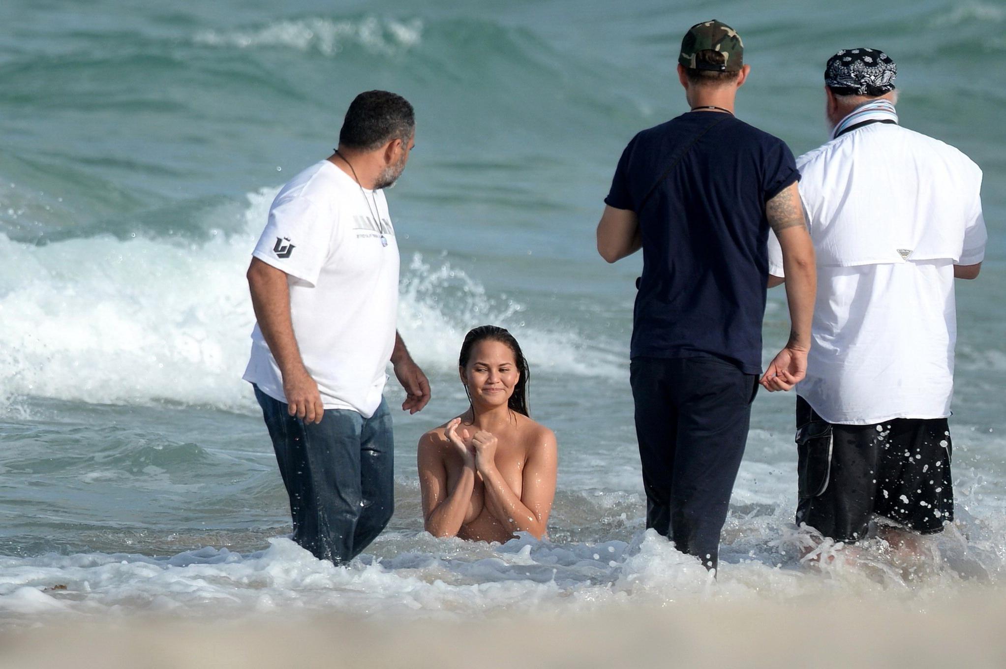 16P Chrissy Teigen showing off her big boobs and shaved pussy at the photoshoot on M