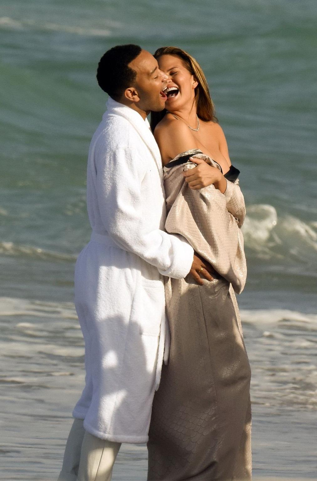 16P Chrissy Teigen showing off her big boobs and shaved pussy at the photoshoot on M