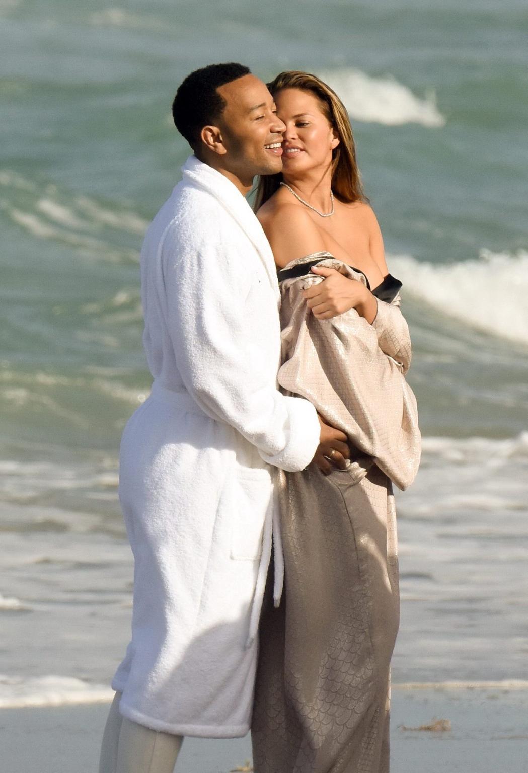 16P Chrissy Teigen showing off her big boobs and shaved pussy at the photoshoot on M