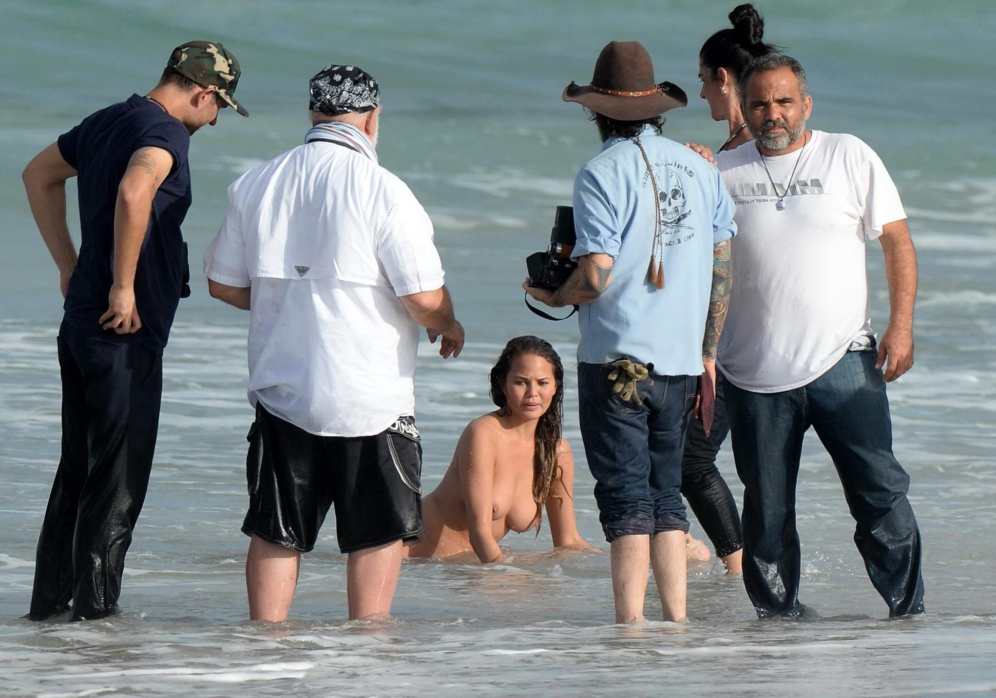 16P Chrissy Teigen showing off her big boobs and shaved pussy at the photoshoot on M