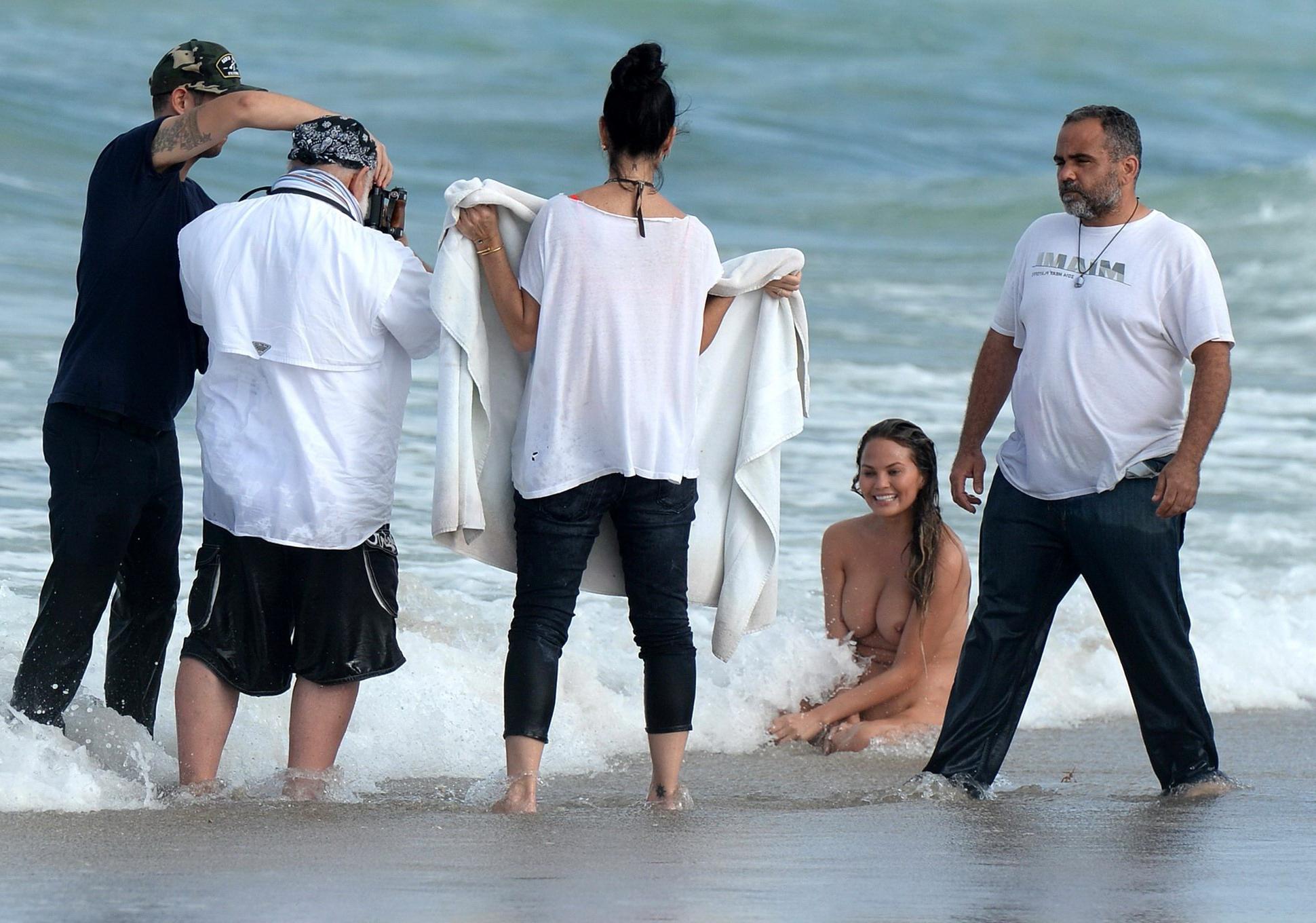 16P Chrissy Teigen showing off her big boobs and shaved pussy at the photoshoot on M