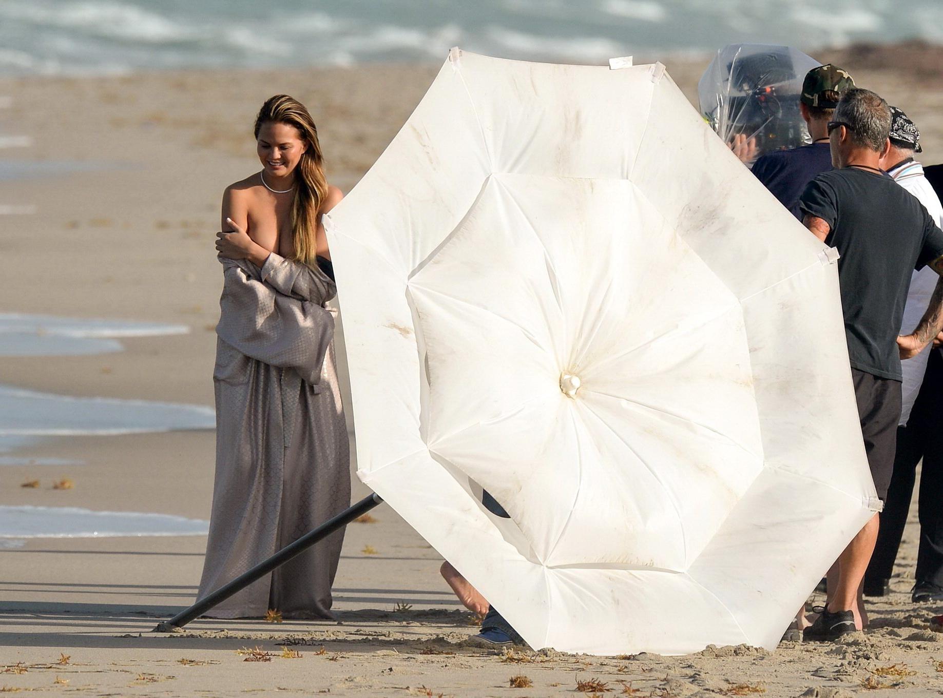 16P Chrissy Teigen showing off her big boobs and shaved pussy at the photoshoot on M