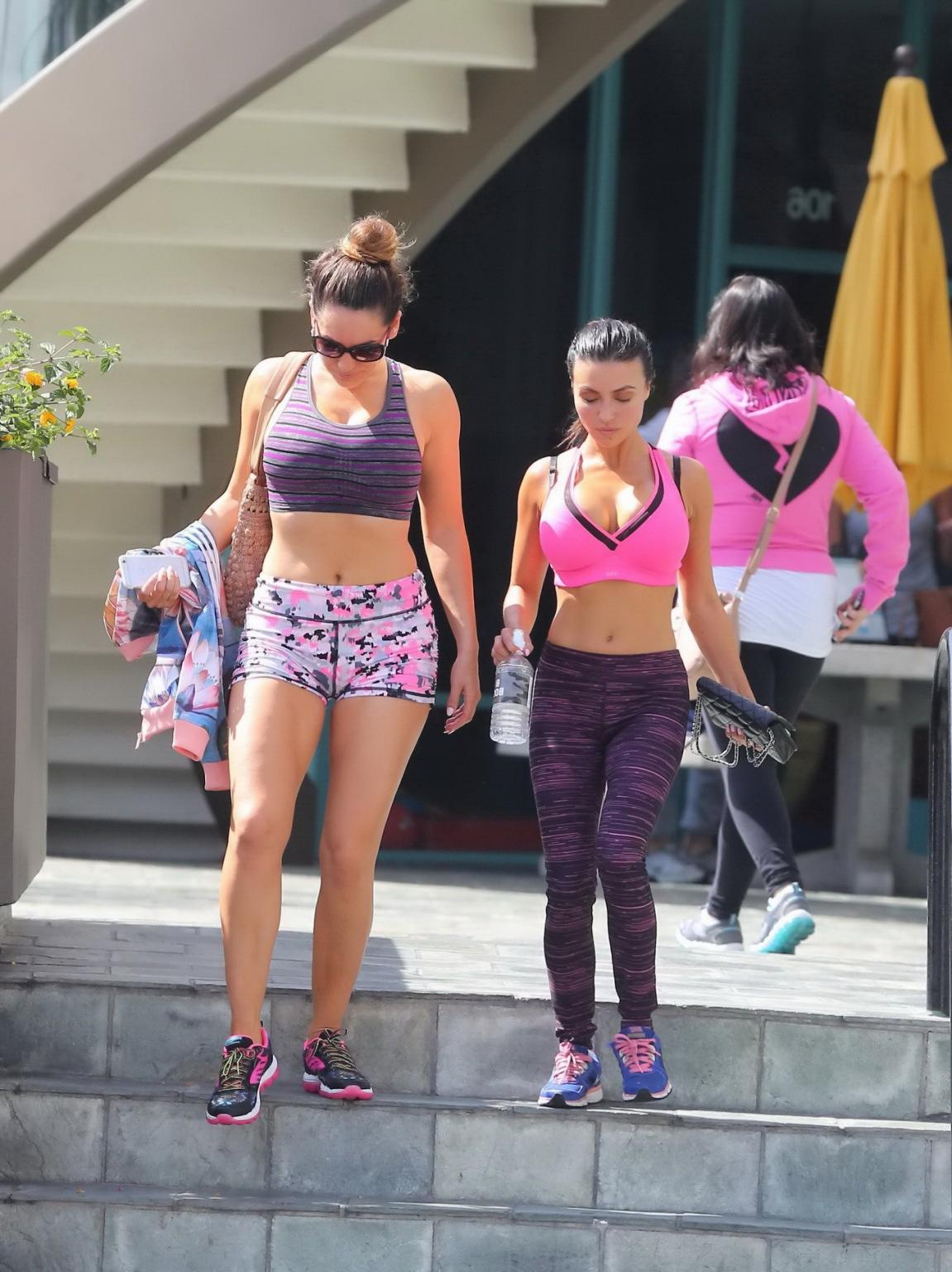 16P Kelly Brook showing her huge boobs and ass in a tiny sports bra and tight shorts