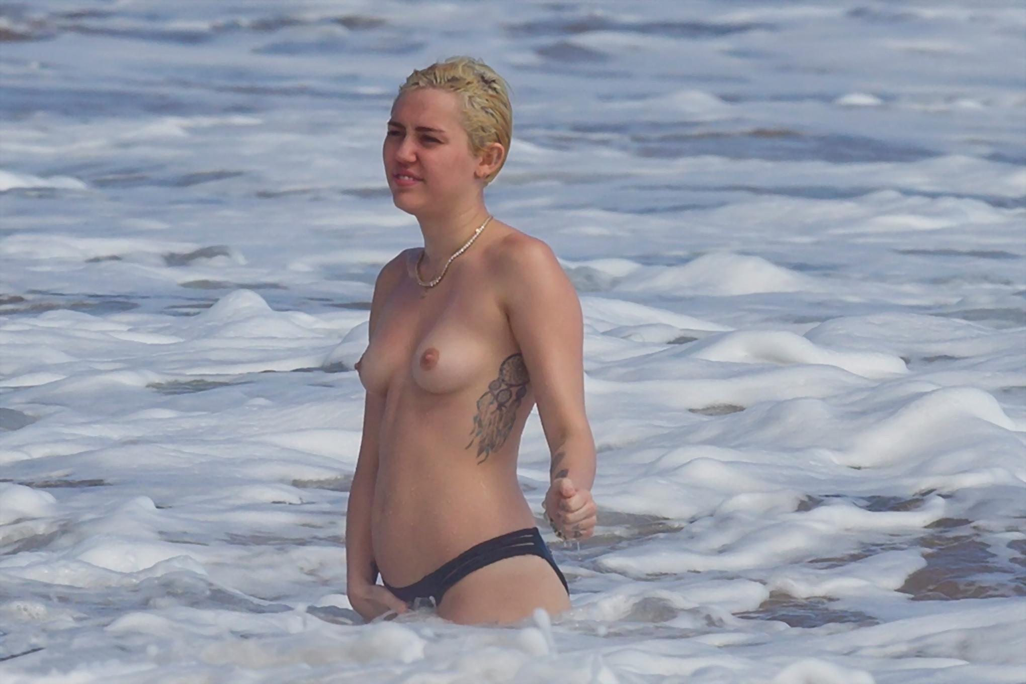 16P Miley Cyrus caught topless at the beach during the vacation in Hawaii