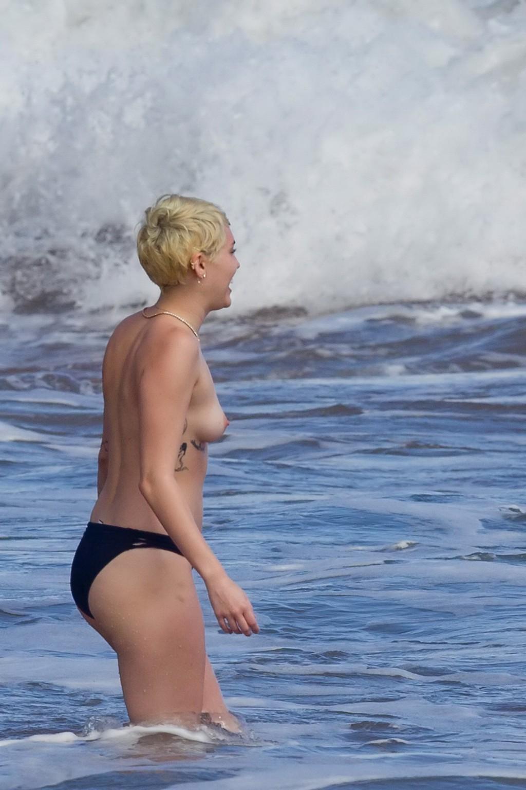 16P Miley Cyrus caught topless at the beach during the vacation in Hawaii