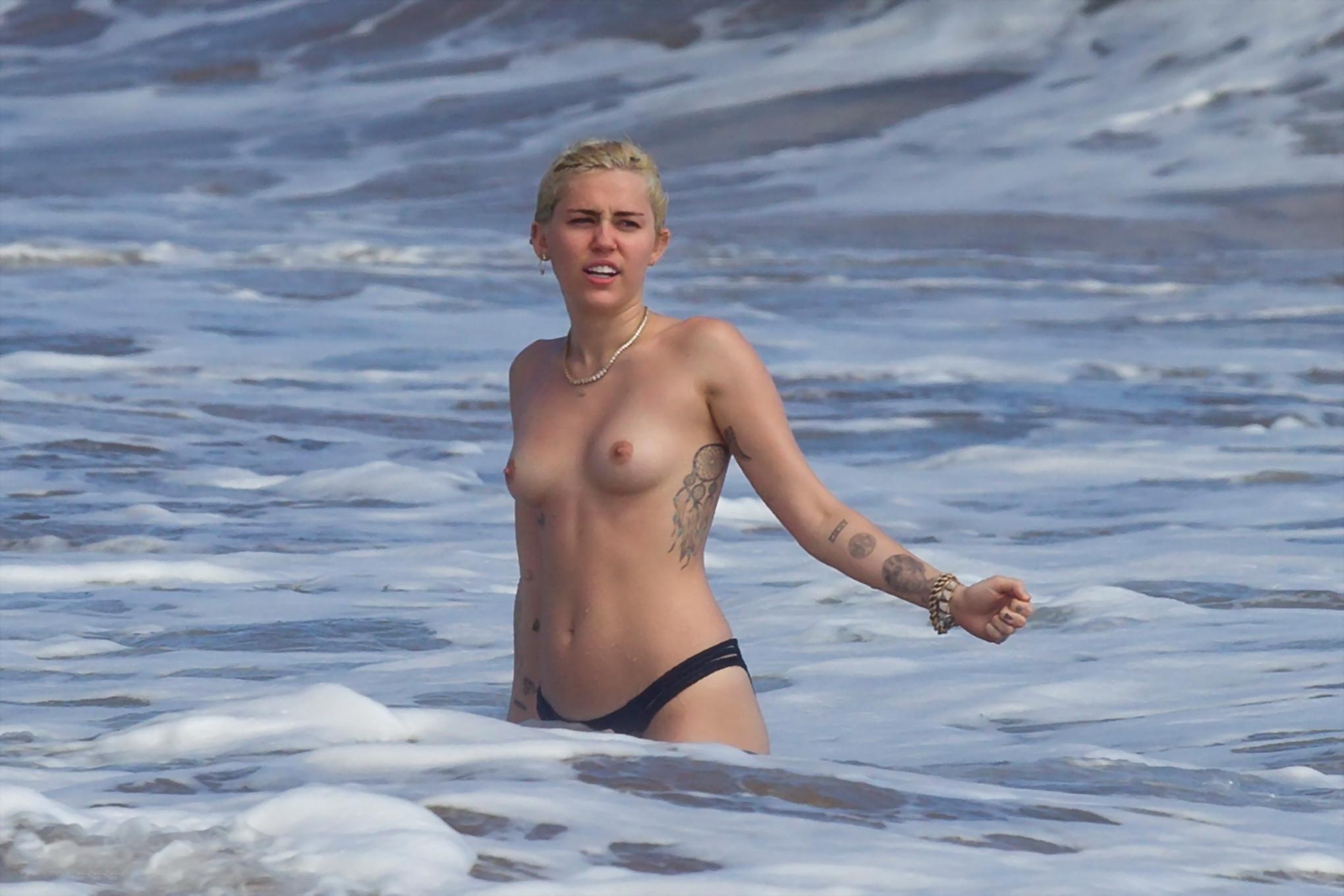 16P Miley Cyrus caught topless at the beach during the vacation in Hawaii