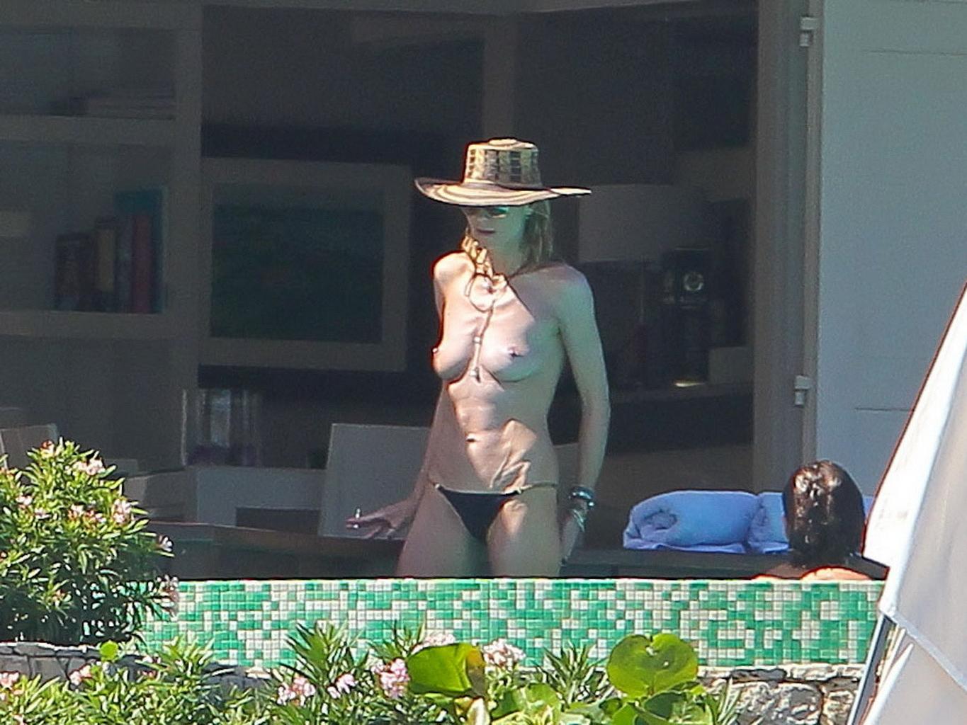 16P Heidi Klum caught topless wearing only black panties while on vacation in StBart