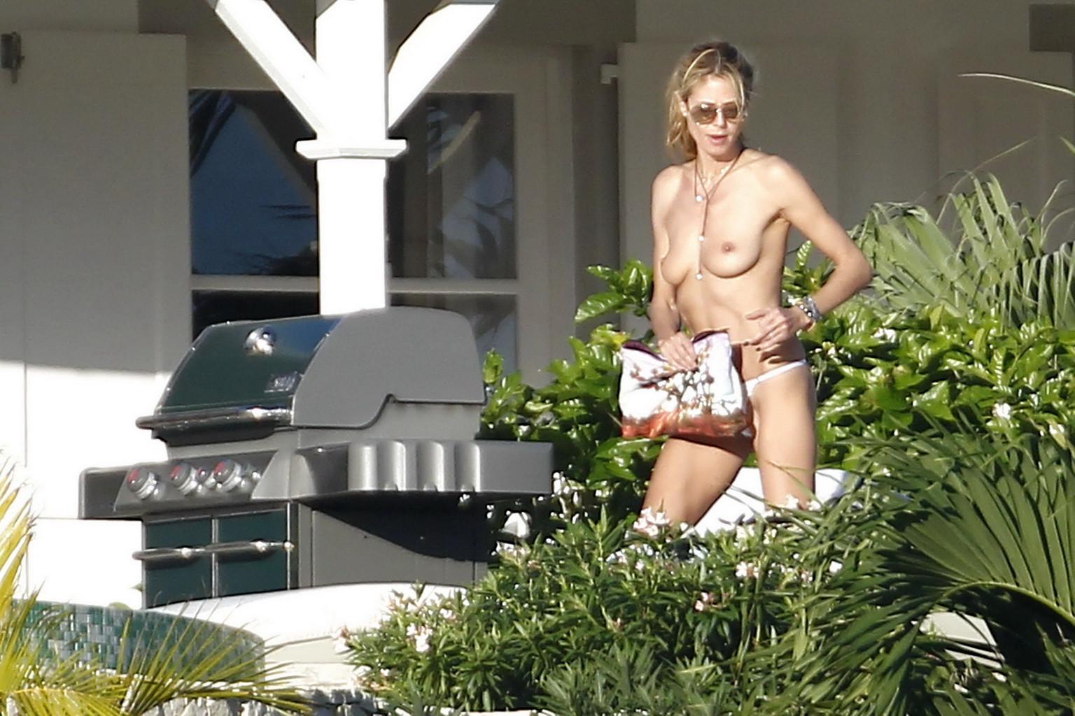 16P Heidi Klum caught topless in a white thong during a vacation in StBarts