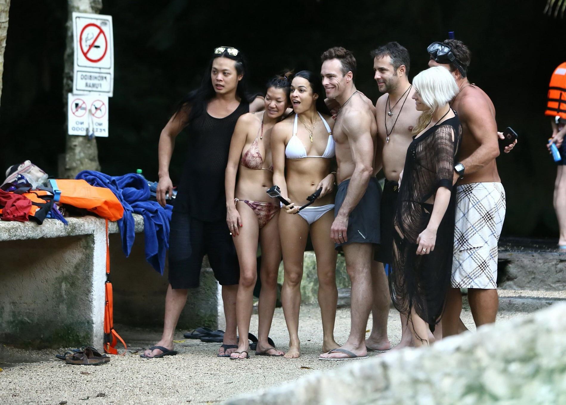 16P Michelle Rodriguez showing underboob and ass crack in white bikini at the beach 