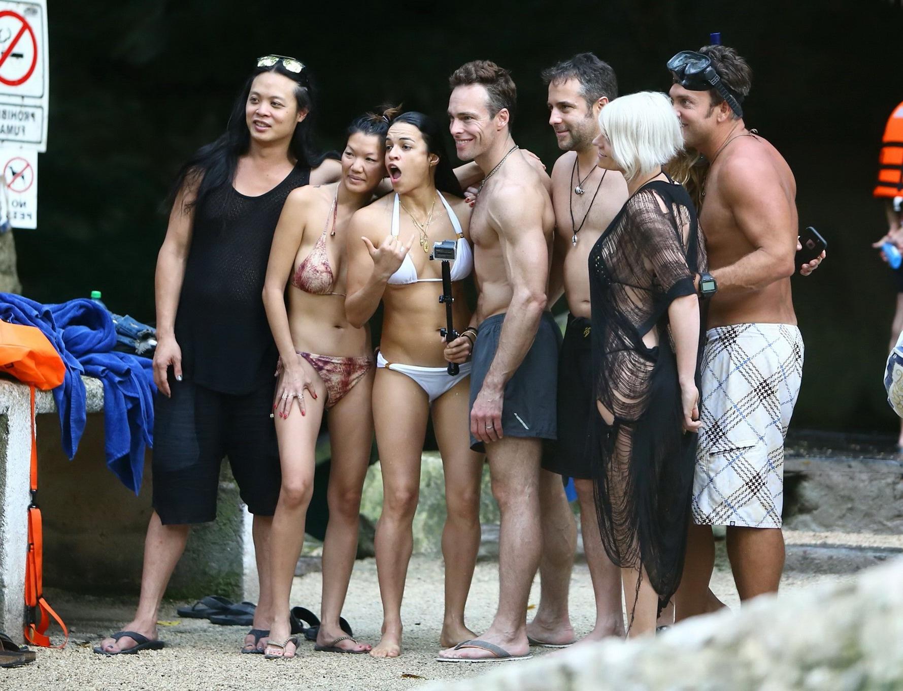 16P Michelle Rodriguez showing underboob and ass crack in white bikini at the beach 