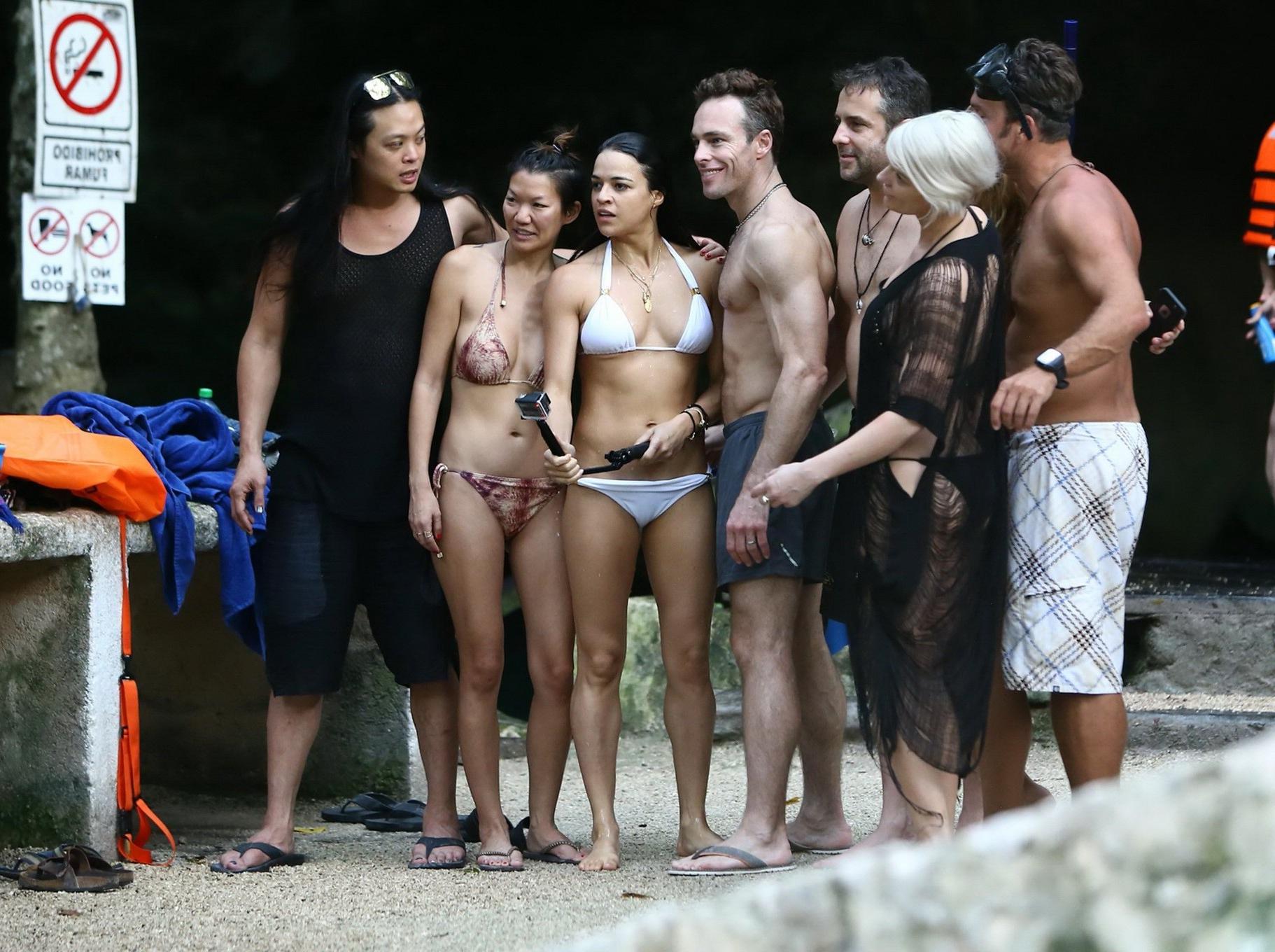 16P Michelle Rodriguez showing underboob and ass crack in white bikini at the beach 