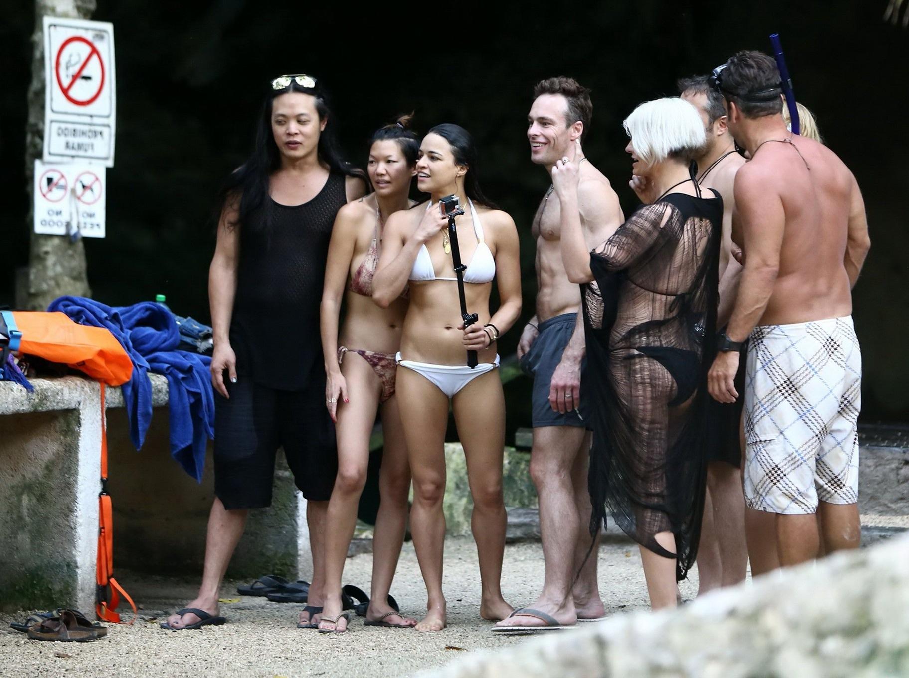 16P Michelle Rodriguez showing underboob and ass crack in white bikini at the beach 