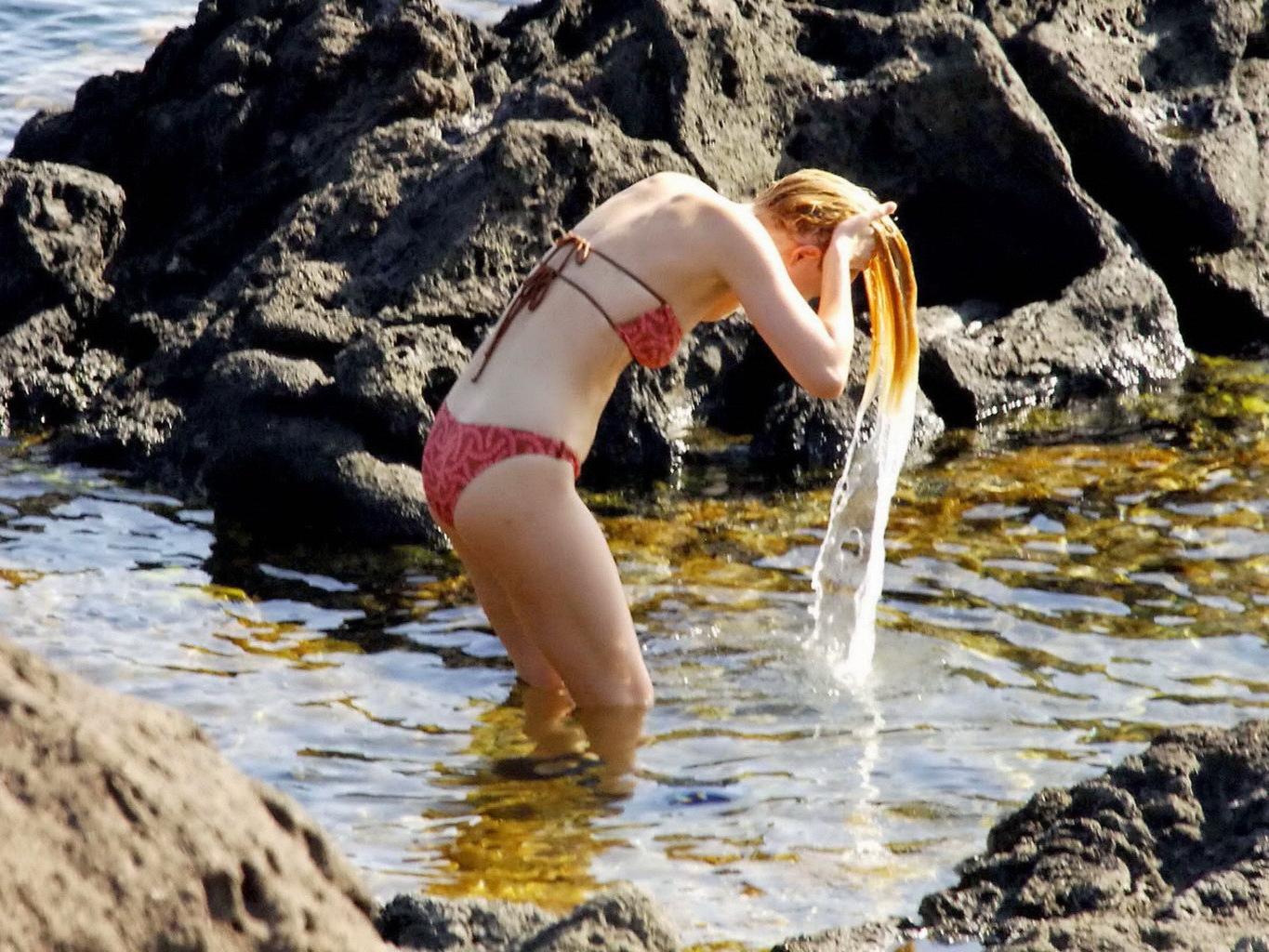 16P Dakota Johnson caught topless at the beach during a vacation in Italy