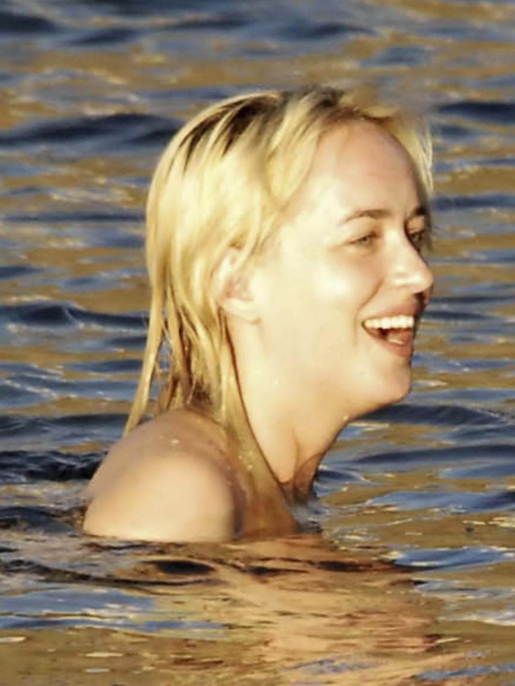 16P Dakota Johnson caught topless at the beach during a vacation in Italy