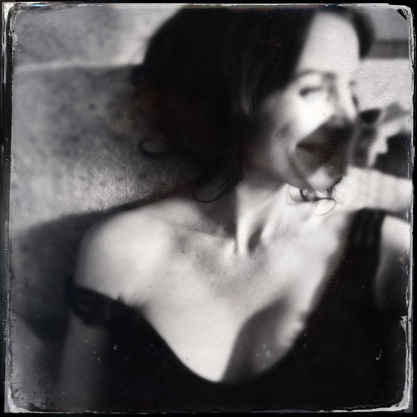16P Busty CarrieAnne Moss wearing a low cut black dress in Catherine Just Photoshoot