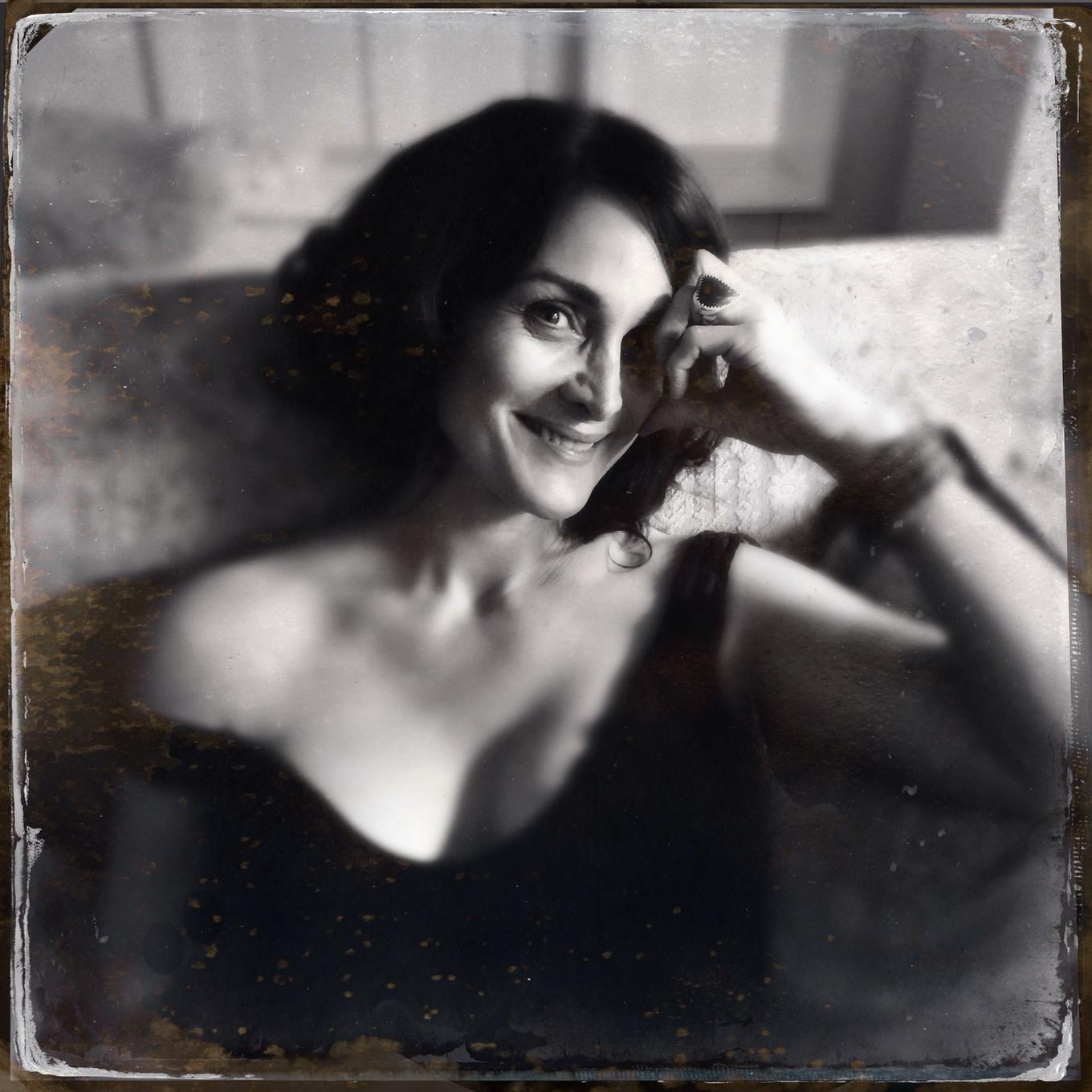 16P Busty CarrieAnne Moss wearing a low cut black dress in Catherine Just Photoshoot