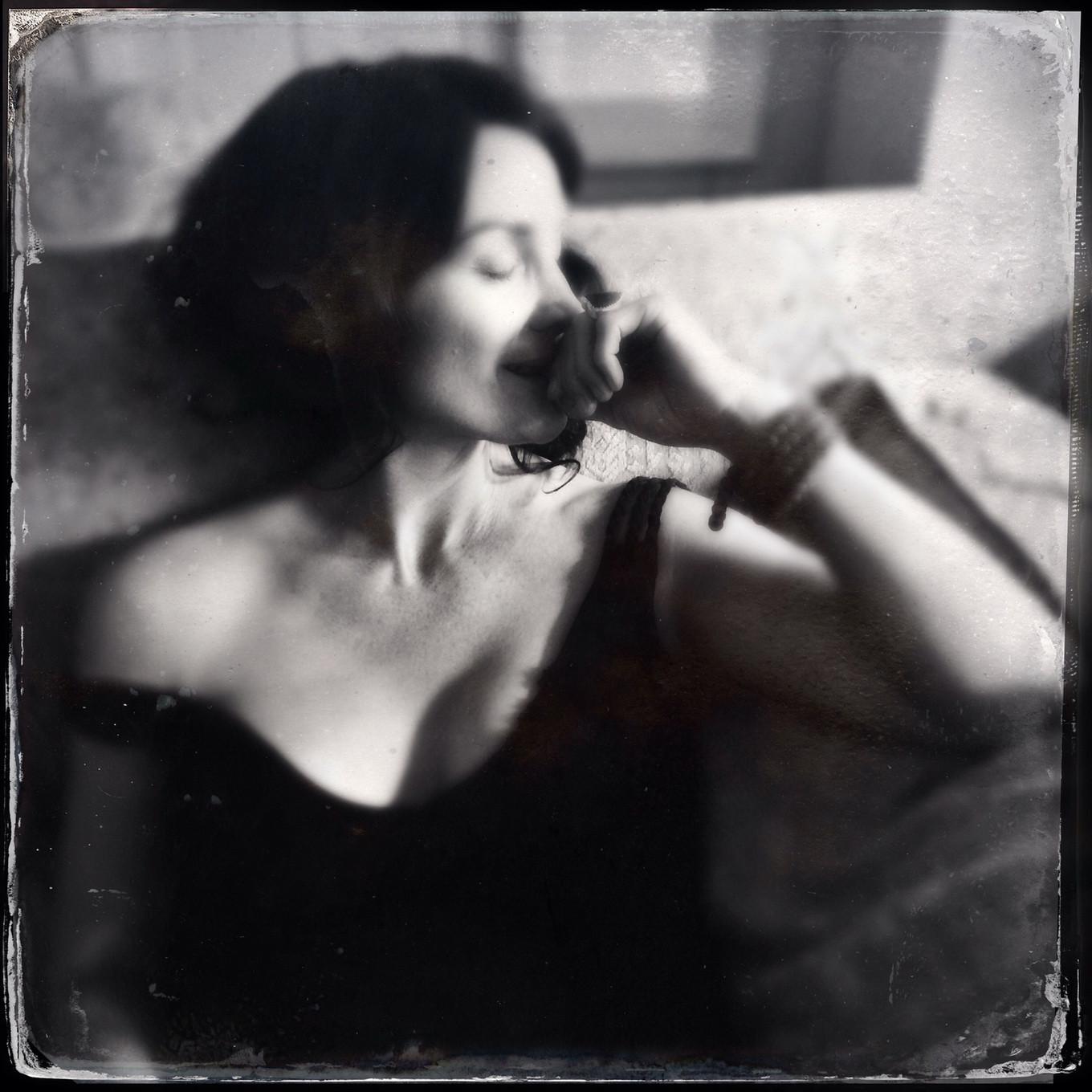16P Busty CarrieAnne Moss wearing a low cut black dress in Catherine Just Photoshoot