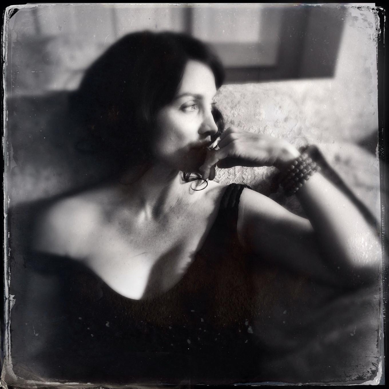 16P Busty CarrieAnne Moss wearing a low cut black dress in Catherine Just Photoshoot