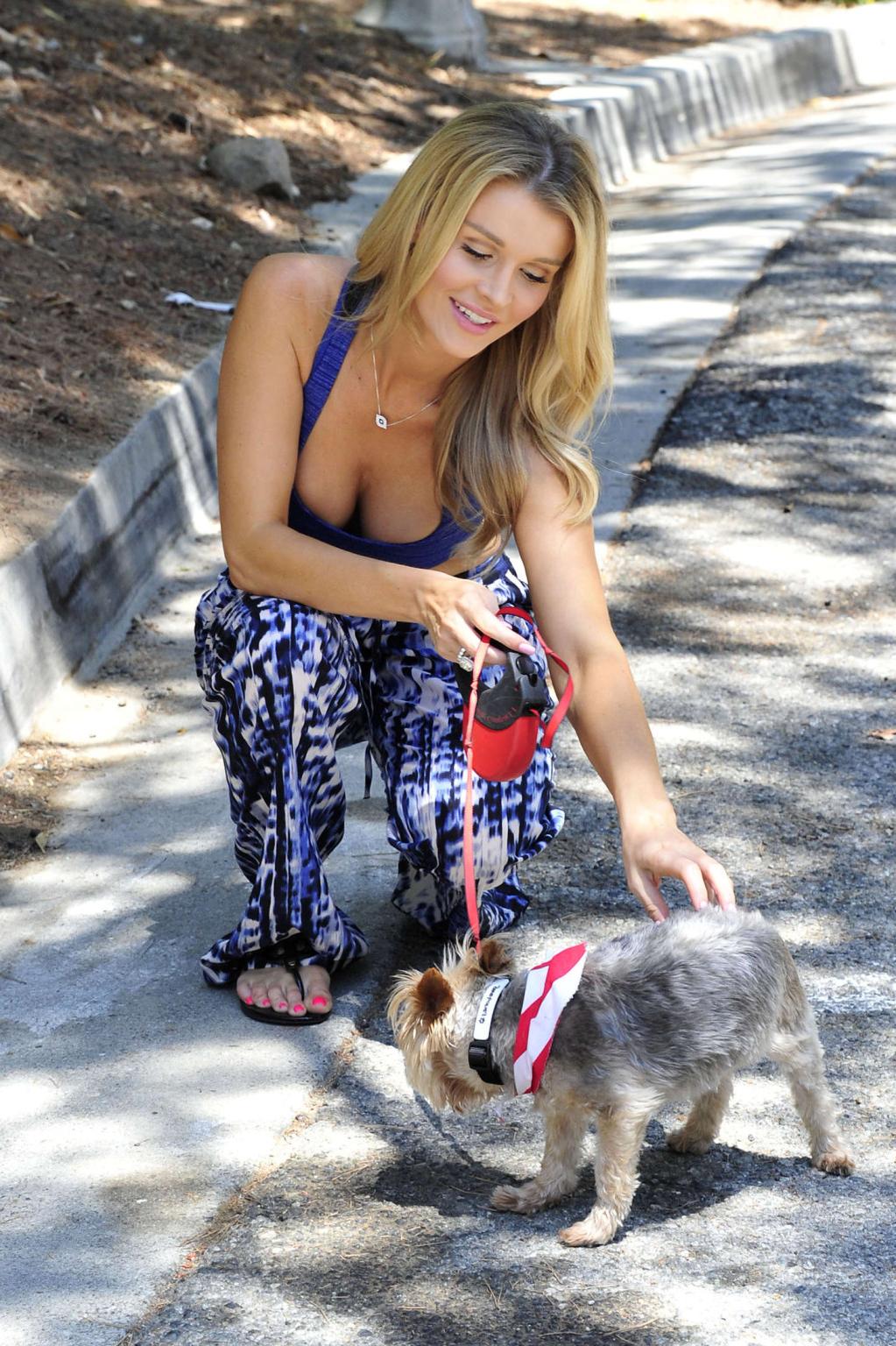 10P Joanna Krupa busty in a blue sports bra walking her dog in Miami