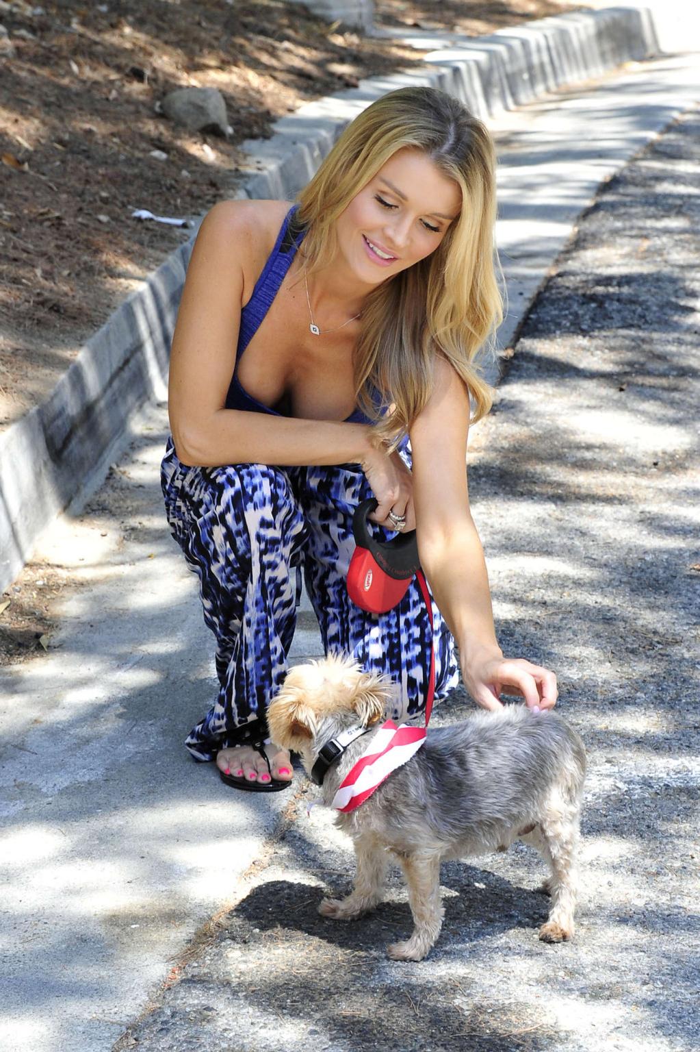 10P Joanna Krupa busty in a blue sports bra walking her dog in Miami