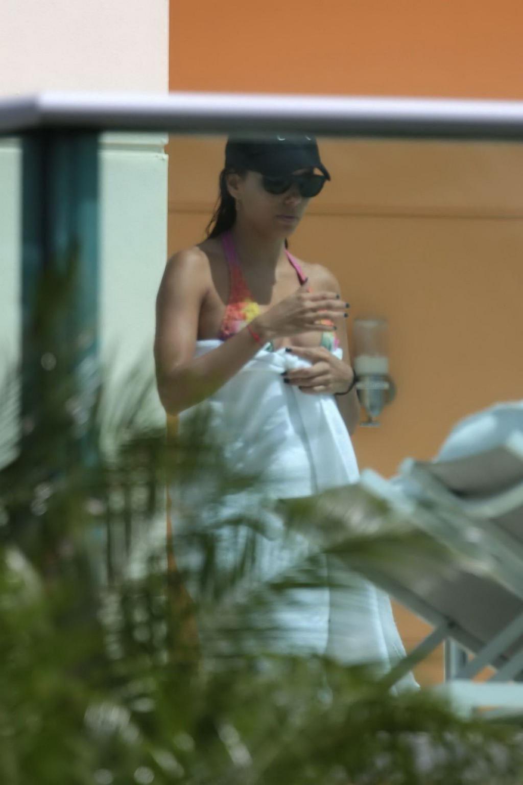 12P Eva Longoria caught in a tiny colorful bikini poolside in Miami