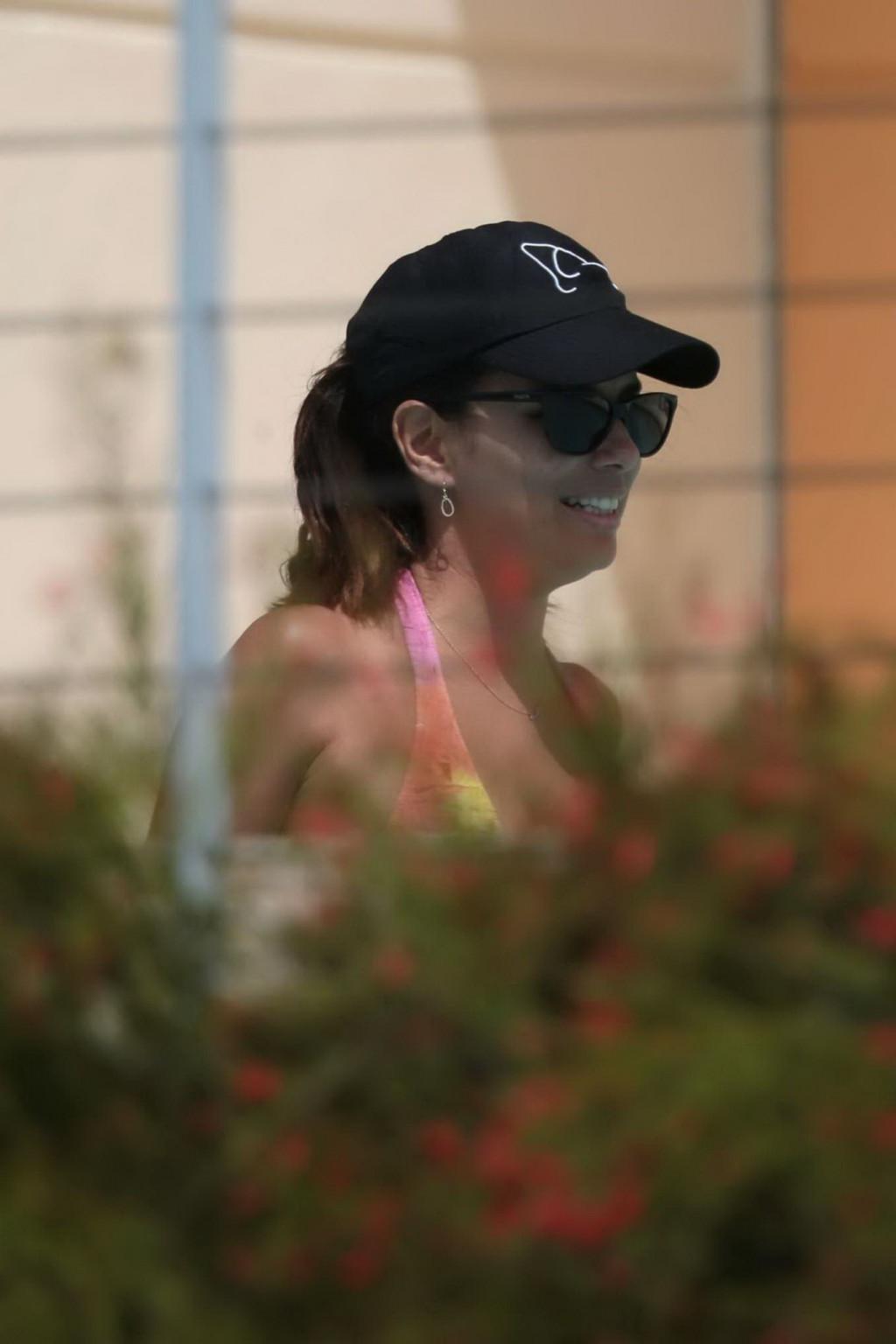 12P Eva Longoria caught in a tiny colorful bikini poolside in Miami