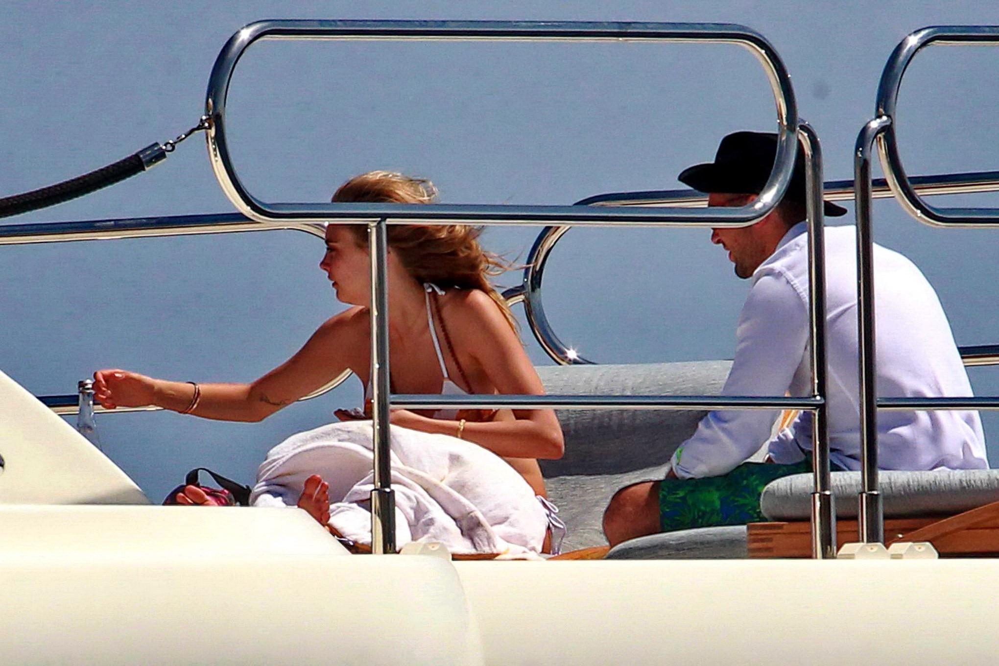 16P Cara Delevingne wearing a bikini on a yacht in Ibiza