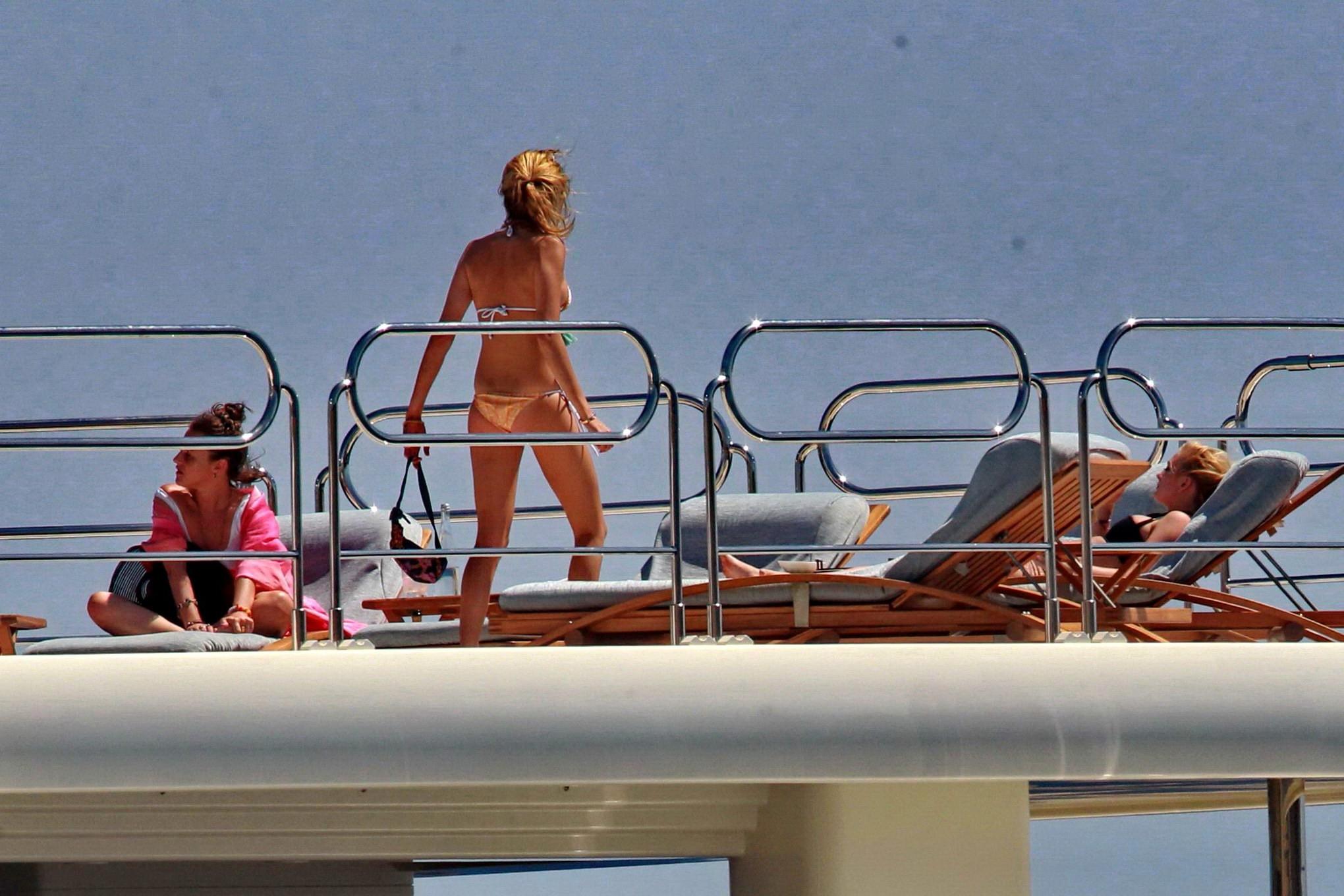 16P Cara Delevingne wearing a bikini on a yacht in Ibiza