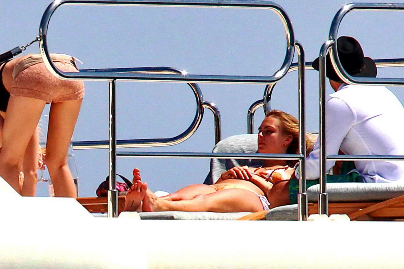16P Cara Delevingne wearing a bikini on a yacht in Ibiza