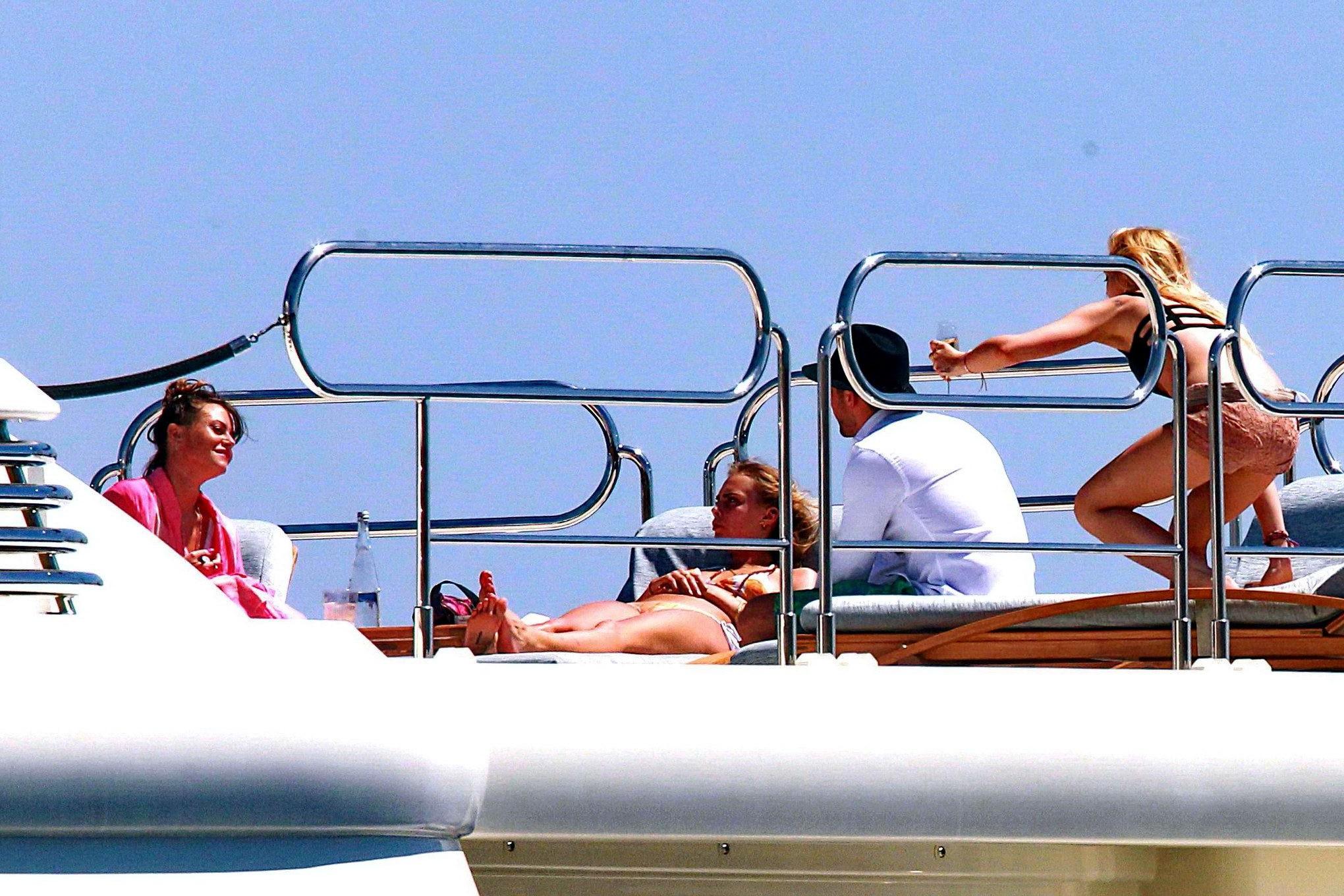 16P Cara Delevingne wearing a bikini on a yacht in Ibiza