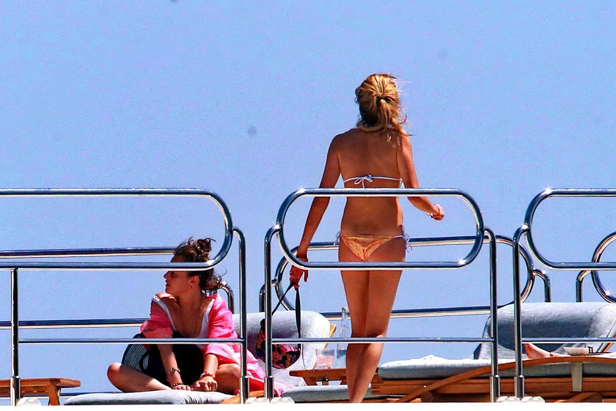 16P Cara Delevingne wearing a bikini on a yacht in Ibiza