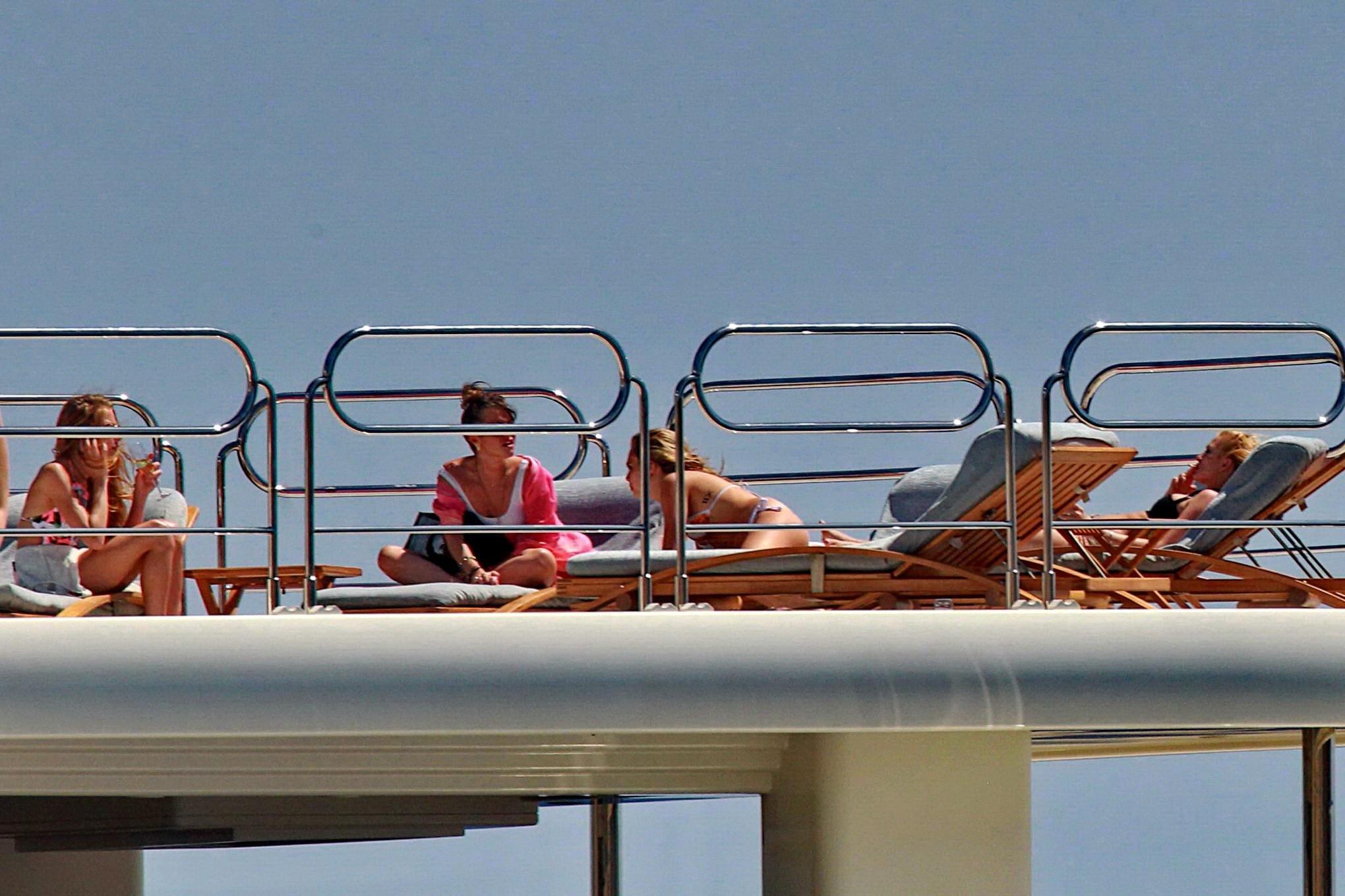 16P Cara Delevingne wearing a bikini on a yacht in Ibiza