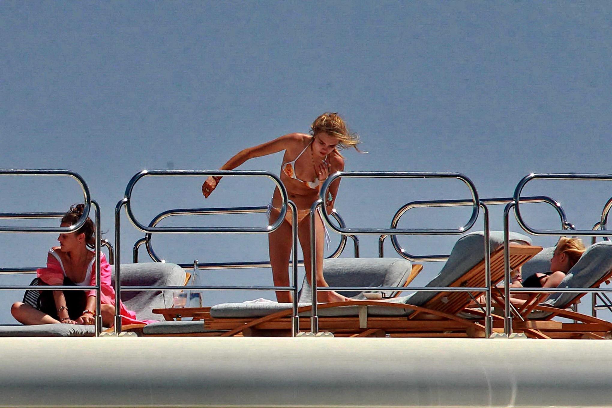 16P Cara Delevingne wearing a bikini on a yacht in Ibiza
