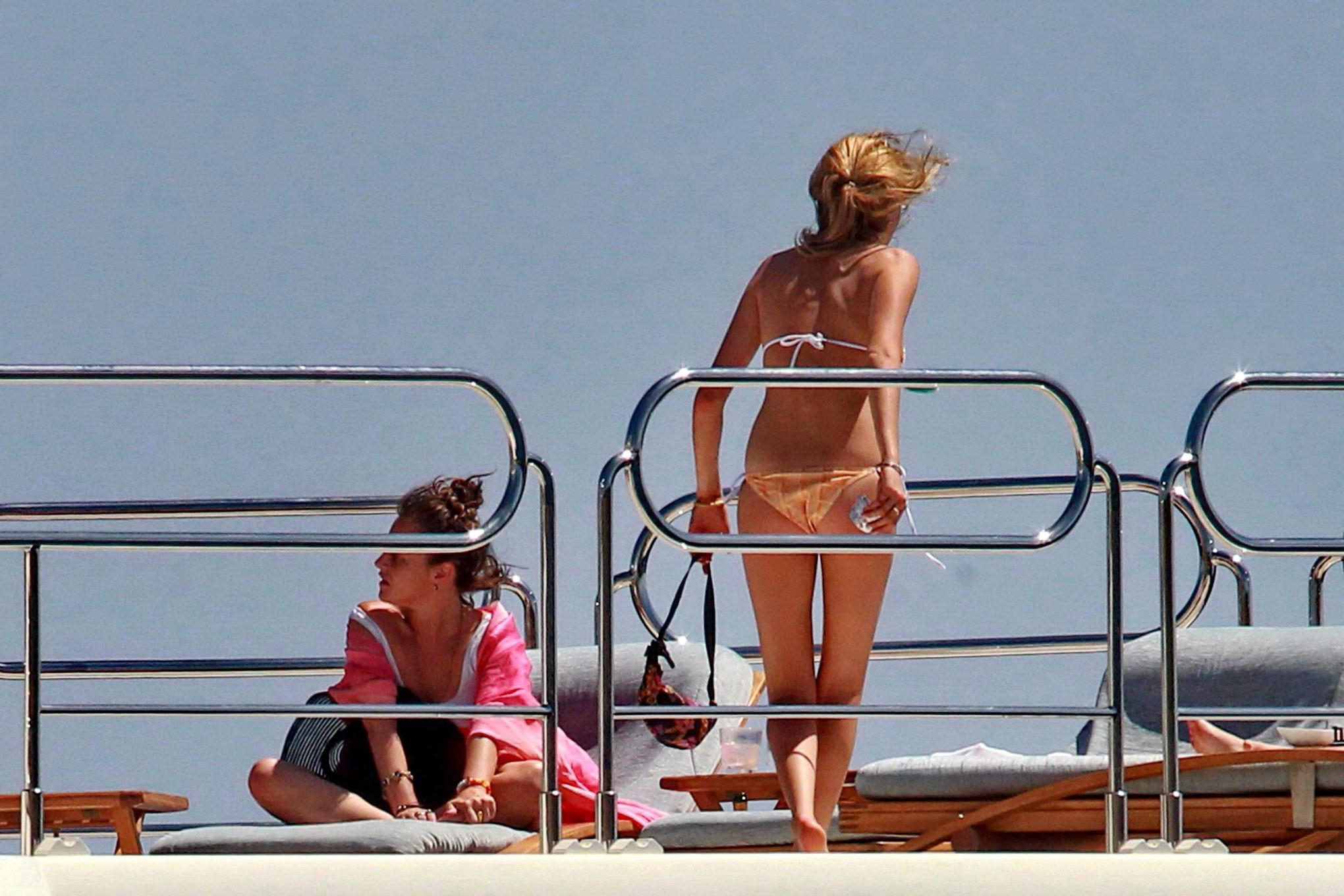 16P Cara Delevingne wearing a bikini on a yacht in Ibiza