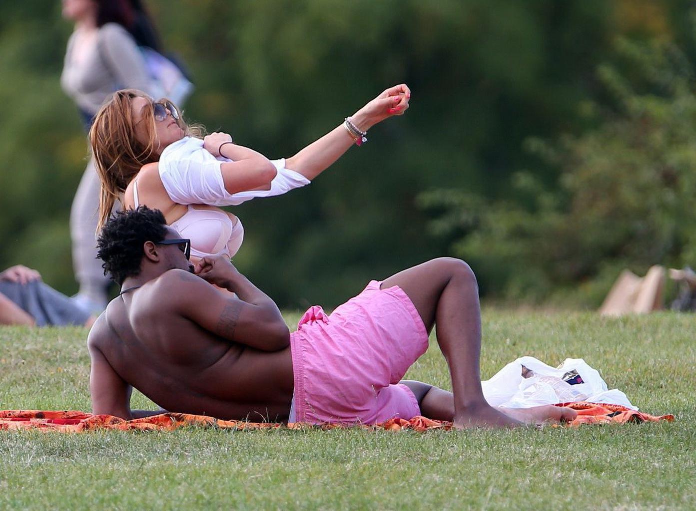 16P Lisa Snowdon caught while tanning in a thong lingerie at Finsbury Park in London