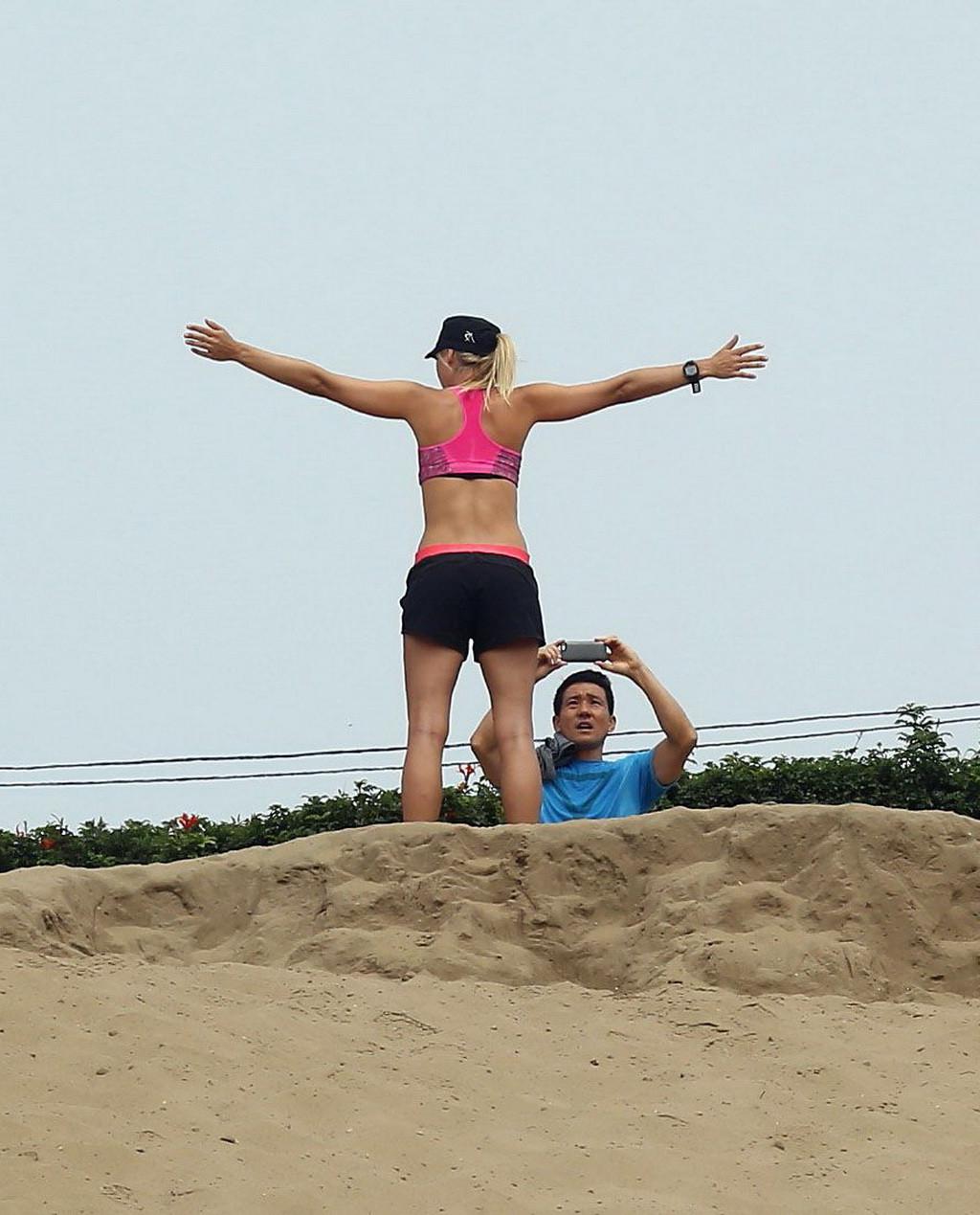 10P Maria Sharapova shows off her abs wearing a sports bra for a hike in California