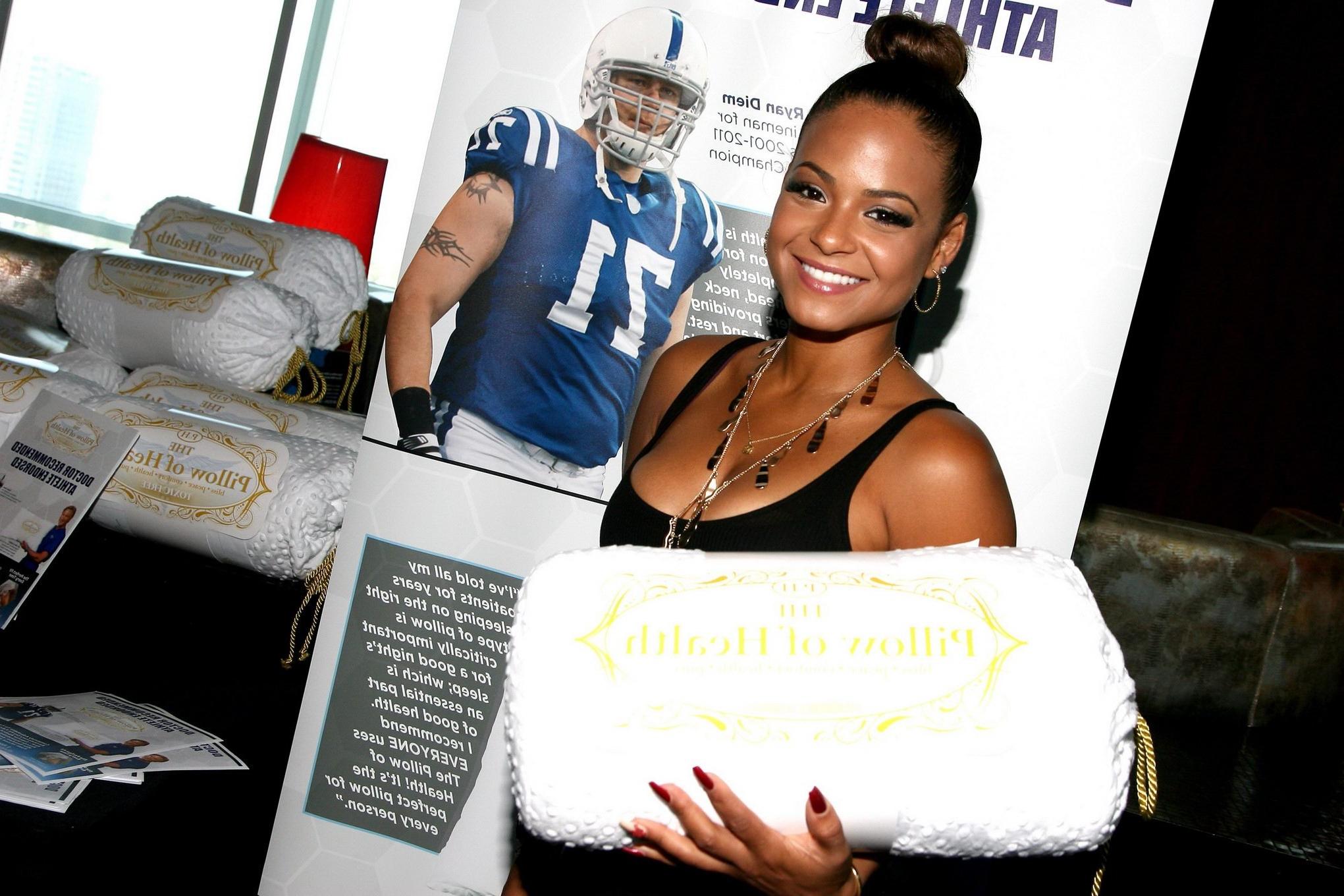 16P Christina Milian cleavy wearing a little black dress at GBK Luxury Sports Lounge