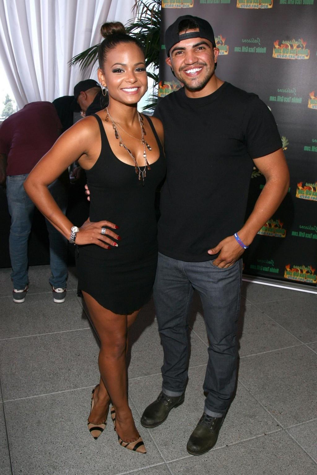16P Christina Milian cleavy wearing a little black dress at GBK Luxury Sports Lounge