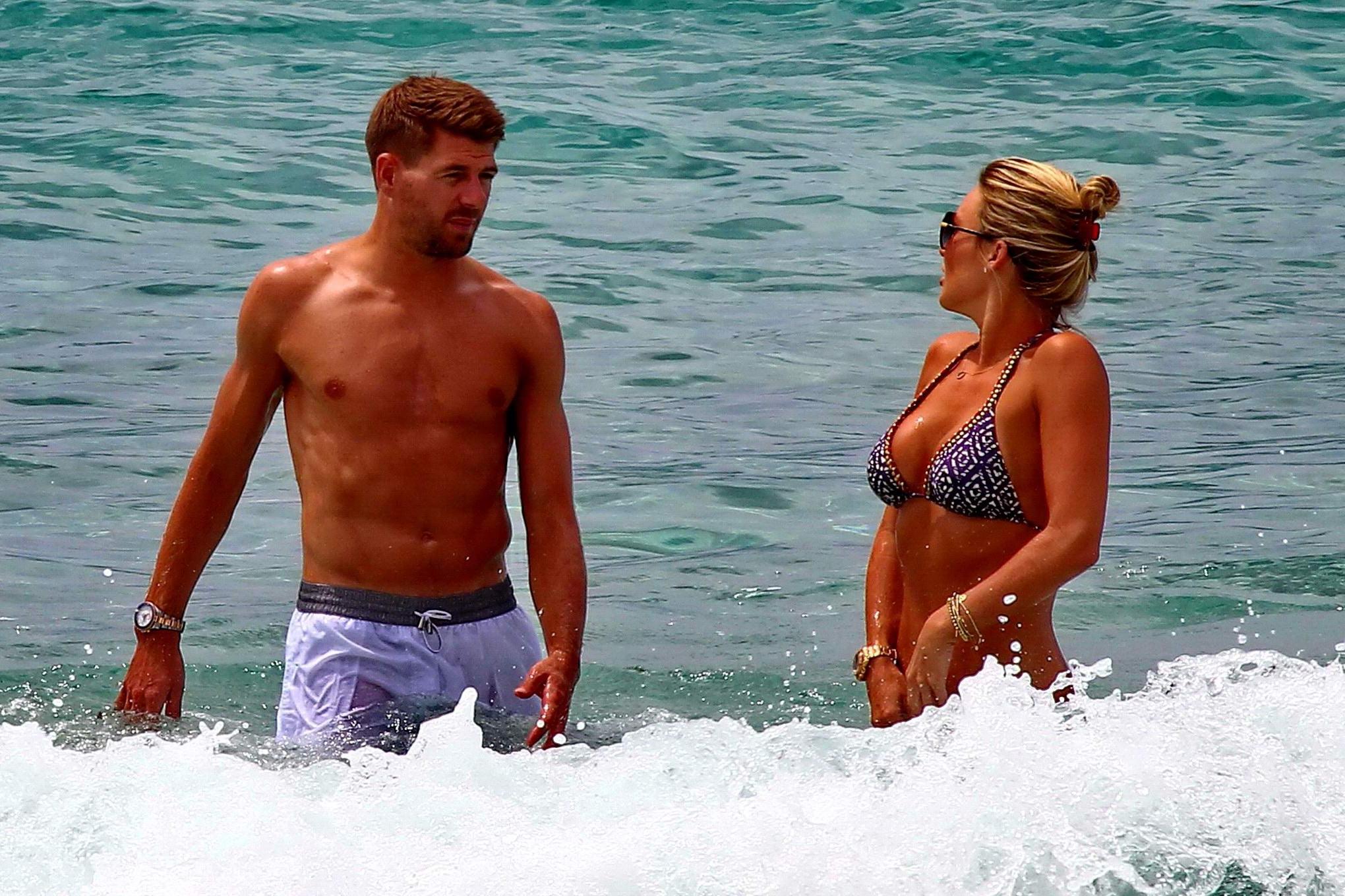 16P Busty Alex Gerrard wearing a bikini on a beach in Ibiza