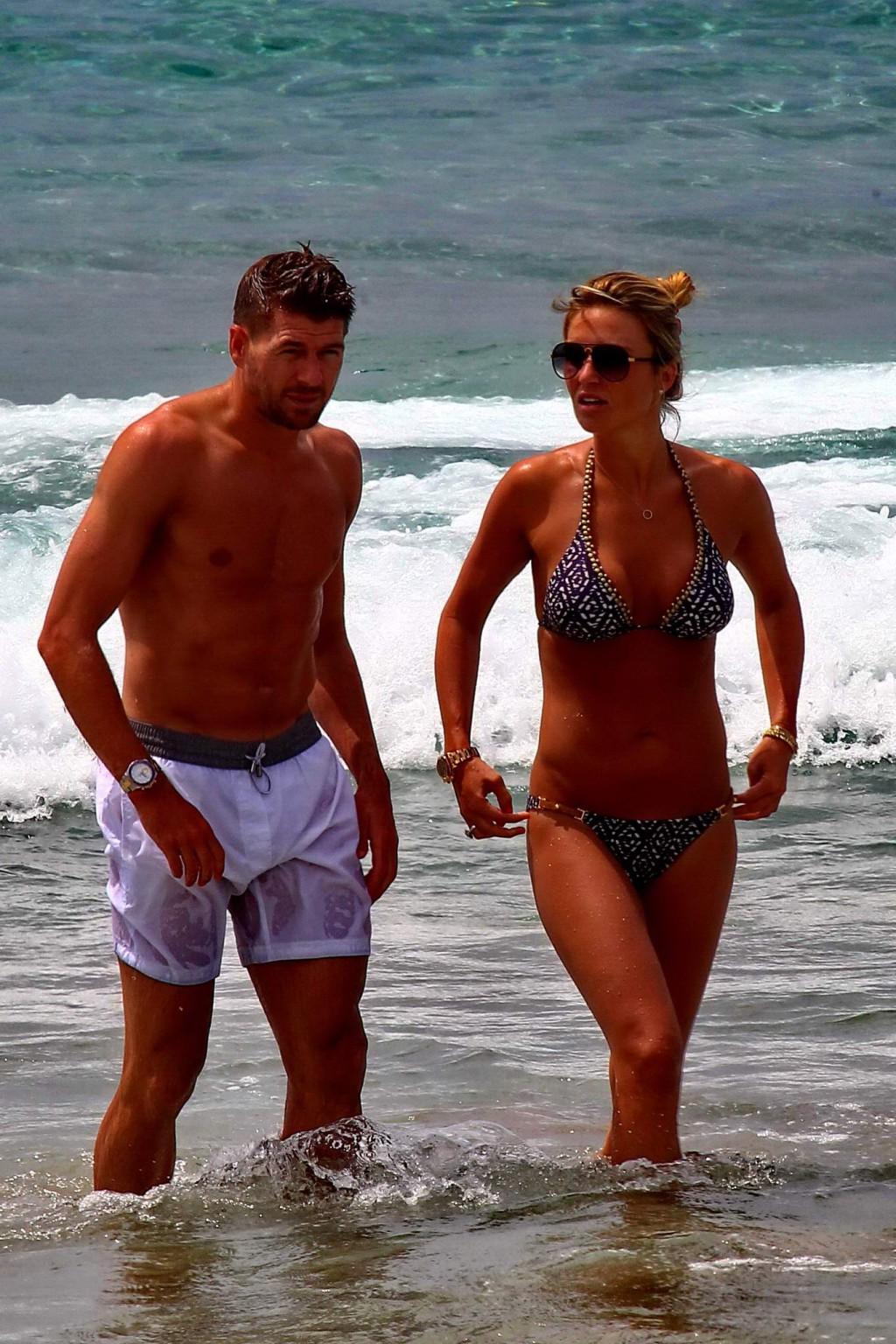 16P Busty Alex Gerrard wearing a bikini on a beach in Ibiza